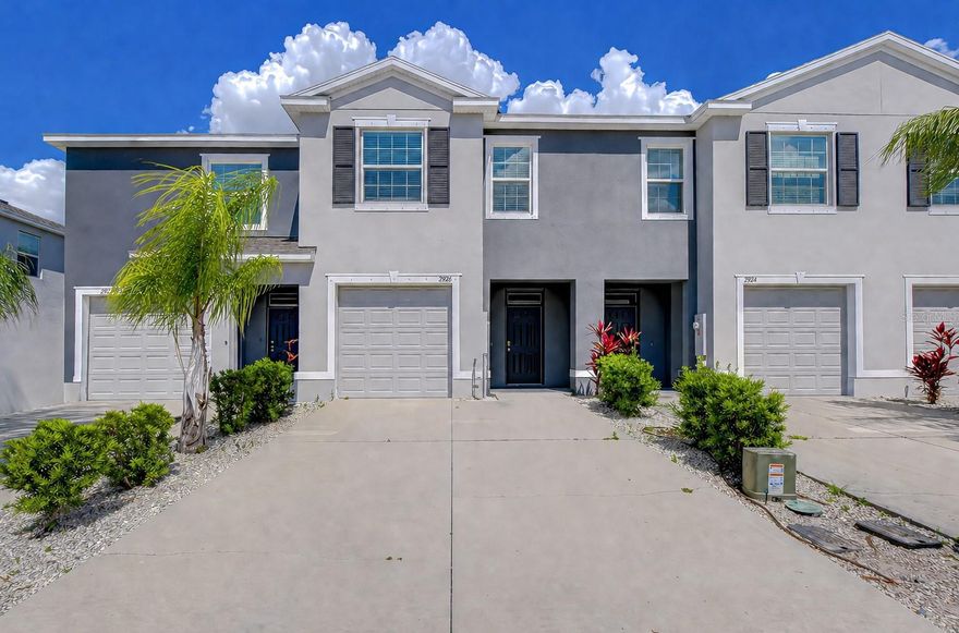 One or more photo(s) has been virtually staged. Searching for a move-in ready, 2021-built townhome with an upgraded kitchen, screened-in lanai, resort-style amenities, and easy access to the Suncoast Parkway? This 3 bedroom, 2.5 bathroom, 1,673 sq ft middle-unit home delivers all of this and more! On the first floor, the kitchen showcases granite countertops, stainless steel appliances, a custom tile backsplash, and a true walk-in pantry, opening seamlessly to the open living and dining spaces. Neutral tile flooring runs throughout the downstairs, complemented by a half bathroom and 1 car garage just off the entryway. Sliding glass doors lead to a fully screened-in lanai with a white vinyl privacy fence, creating a private, finished outdoor space that’s perfect for relaxing or entertaining. Upstairs, the primary suite features dual vanities, a walk-in shower, and two walk-in closets. Secondary bedrooms are thoughtfully separated for privacy, each offering ample closet space, and share a full bathroom conveniently located just off the hallway. The upstairs laundry room adds to the home’s functional layout. Residents of The Preserve enjoy access to two pools, a fitness center, sports courts, playground, and a dog park, along with direct community access to the Suncoast Trail. Conveniently located with easy access to SR 54 and the Suncoast Parkway, offering a quick commute to Tampa International Airport, Downtown Tampa, as well as premier shopping, dining, and entertainment.
