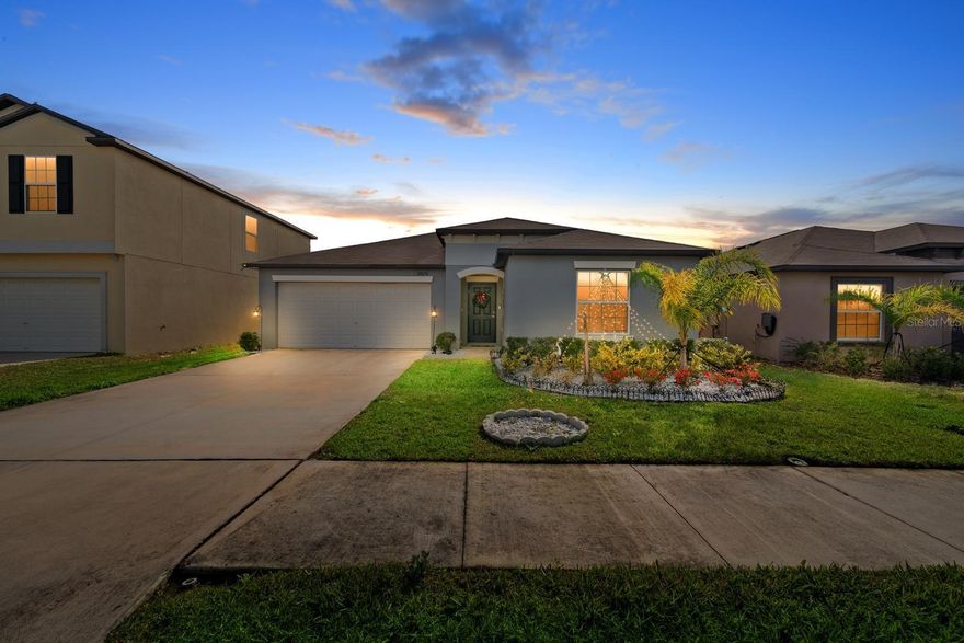 Built in 2023, this impressive 4-bedroom, 2-bath, 2-car garage home offers 1,936 sq ft of thoughtfully designed living space and is tucked away on a quiet cul-de-sac in the highly desirable Mirada master-planned community in San Antonio, Florida. From the moment you arrive, you’ll appreciate the elongated driveway accommodating up to six vehicles, fresh exterior landscaping with white rock perimeter accents, and a fully fenced backyard with new sod—perfect for privacy and outdoor enjoyment.
Inside, the open floor plan seamlessly connects the family room, dining area, and kitchen, making it ideal for both everyday living and entertaining. Tile flooring spans the main living areas, while the bedrooms are comfortably carpeted. The kitchen is beautifully appointed with all-wood cabinetry featuring pull-out drawers, granite countertops, a stylish backsplash, recessed lighting, and stainless steel appliances—all included. A water softener system and reverse osmosis drinking water system add everyday convenience and quality.
Just off the dining area, double sliding glass doors lead to a large paved lanai featuring a covered insulated aluminum roof, outdoor ceiling lights, and ceiling fans—an ideal space to relax or host gatherings year-round.
The owner’s suite is privately situated and offers a serene retreat, complete with a spacious walk-in closet and a spa-like bathroom featuring dual vanities and a glass-enclosed shower. Three additional bedrooms provide flexibility for guests, family, or a home office. The epoxy-coated garage floor adds a polished touch to the spacious two-car garage. (Washer and dryer do not convey.)
Community Highlights: Mirada is home to the iconic 15-acre lagoon—the largest in the nation, delivering a true beach-style lifestyle with swimming, kayaking, paddleboarding, and sandy relaxation. Residents enjoy scenic multi-modal paths, nature trails, a playground, and a dog park. Conveniently located just minutes from I-75, Mirada offers easy access to downtown Tampa while maintaining a peaceful suburban setting!