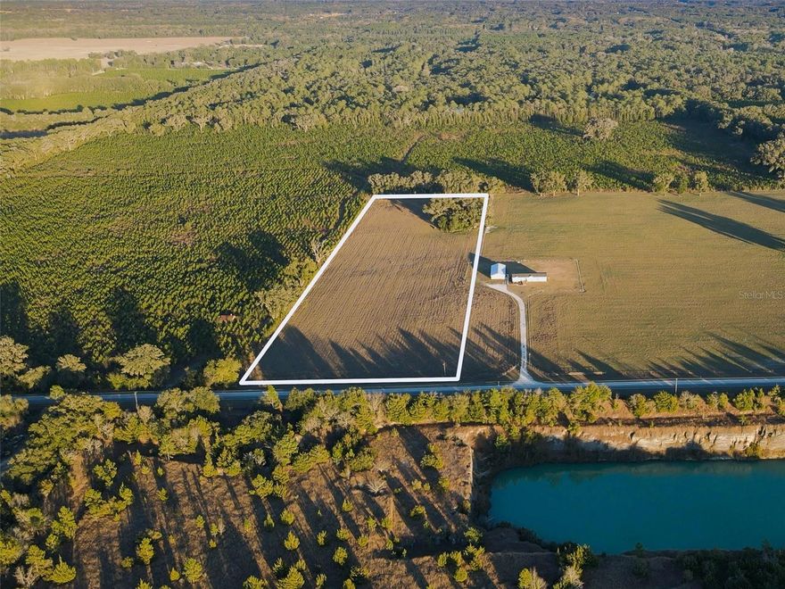 Welcome to Quarry Fields, a small, private subdivision featuring four 10-acre lots, located just 2.4 miles off Newberry Road on NW 202nd St. This listing is for Lot 1, the northernmost parcel. This property features ideal pasture land, perfect for livestock, horses, or other agricultural pursuits. Lot 1 also features a large dog kennel and a versatile pig pen with a concrete pad, complete with multiple stalls that can be adapted for a variety of uses. Both the dog kennel and pig pen sit towards the back end of this property and can be utilized or removed. The 10-acre parcel may be purchased individually or alongside the three neighboring 10-acre parcels, offering potential to expand your estate, create a family compound, or pursue investment or agricultural opportunities. Purchasing land in Quarry Fields gives you the opportunity to build your dream homestead—whether that means constructing a custom home, establishing farmland, or simply enjoying peaceful country living with room to breathe. Here, you’ll experience true peace and tranquility while remaining just minutes from shopping, hospitals, and all that Gainesville has to offer. Schedule your private showing today!