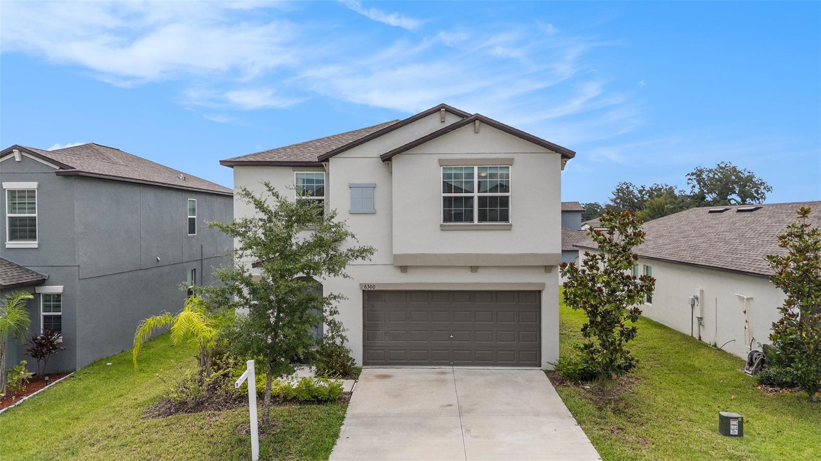 Welcome to this beautifully maintained two-story home in the heart of Zephyrhills. A 2023 build, offering over 2,200 sq ft of living space, 5 bedrooms, 2.5 bathrooms, and a 2-car garage. Located in the sought-after community, Abbot Square, with a resort-style pool, playground, and fitness center, this home has everything you need for comfortable Florida living. The open-concept first floor features a flowing kitchen, dining, and living room combo, perfect for entertaining. The kitchen is equipped with stainless steel appliances, granite countertops, a center island for prep and casual meals, and a walk-in pantry for added storage. A laundry room is conveniently located just off the kitchen, and a half bath completes the first floor. Upstairs, you’ll find all five bedrooms and a spacious loft/family room, ideal for a second living area or playroom. The primary suite offers a peaceful retreat with a large walk-in closet, double sink vanity, and a tiled walk-in shower. Additional bedrooms are nicely sized, with one featuring its own walk-in closet, and all share a full bath with a double vanity and shower/tub combo. Step outside to a spacious backyard, perfect for grilling, playing, or soaking up the Florida sun. Located near zoned schools, parks, shopping centers, and dining options - this home blends space, style, and convenience in a growing area. Don't miss your chance to see this fantastic home - schedule your private tour today!