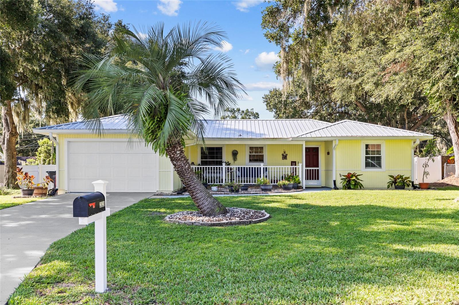 Beautifully Maintained 3 bedroom, 2 bath home with 1,274 sq ft of living space, nestled in an established neighborhood with easy access to shopping, dining, and interstate for convenient commuting. Sitting on a large, fenced lot shaded by gorgeous oak trees and mature landscaping, this home offers plenty of outdoor living. Relax on the spacious open front porch—perfect for morning coffee or
evening drinks—or entertain on the screened back porch, complete with two new overhead fans for year-round comfort. The backyard is private and roomy, with a utility shed for lawn equipment and storage. Inside, this home features a split floor plan with generous-sized rooms, updated ceramic tile and new laminate flooring, and abundant natural light from the replaced Double paned windows. The kitchen and living room showcase grand built-in shelves, providing beautiful design and ample storage. The primary suite is a true retreat, with French door leading to the screened lanai. Recent upgrades include a metal roof, newer AC with updated ductwork, and a replaced septic Drain field. Fresh exterior paint gives the home a clean, cozy cottage feel, making it truly move-in ready. With its combination of modern updates, charming details, and a fantastic location, this home is a must-see.