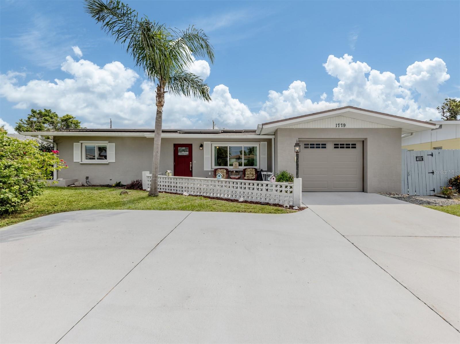 Nestled in the desirable Venice Gardens community, this updated two-bedroom, two-bath residence offers a rare combination of comfort, efficiency and privacy. Featuring hurricane impact windows and doors, a whole-house solar energy system, and nearly 1,300 square feet under air, the home is thoughtfully designed for year-round Florida living.
The interior showcases a large living room with a picture window, an upgraded kitchen with solid maple cabinetry, stainless steel appliances and new countertops, and a sunlit Florida room lined with walls of windows. The spacious floor plan extends outdoors to a covered patio and expansive pool area surrounded by privacy fencing—perfect for entertaining or relaxing in seclusion.
Additional amenities include whole house repiping and a reverse osmosis drinking water system, a whole-house water softener, and a 1.5-car garage with dedicated storage and workbench. The property also offers two outbuildings: a climate-controlled studio or "she shed" ideal for creative pursuits, and a separate storage shed for pool and garden essentials. A dedicated potting area adds functionality for gardening enthusiasts.
Residents may choose to join the nearby Venice Gardens Community Center, which features a clubhouse, large pool and shared garden space. Ideally located close to historic downtown Venice, enjoy boutique shopping, dining, live theatre and the white sands of Venice Beach—all just a short drive away. Membership to Venice Gardens Association is optional. If not a member you can still attend the pool parties and dance parties and craft fairs.