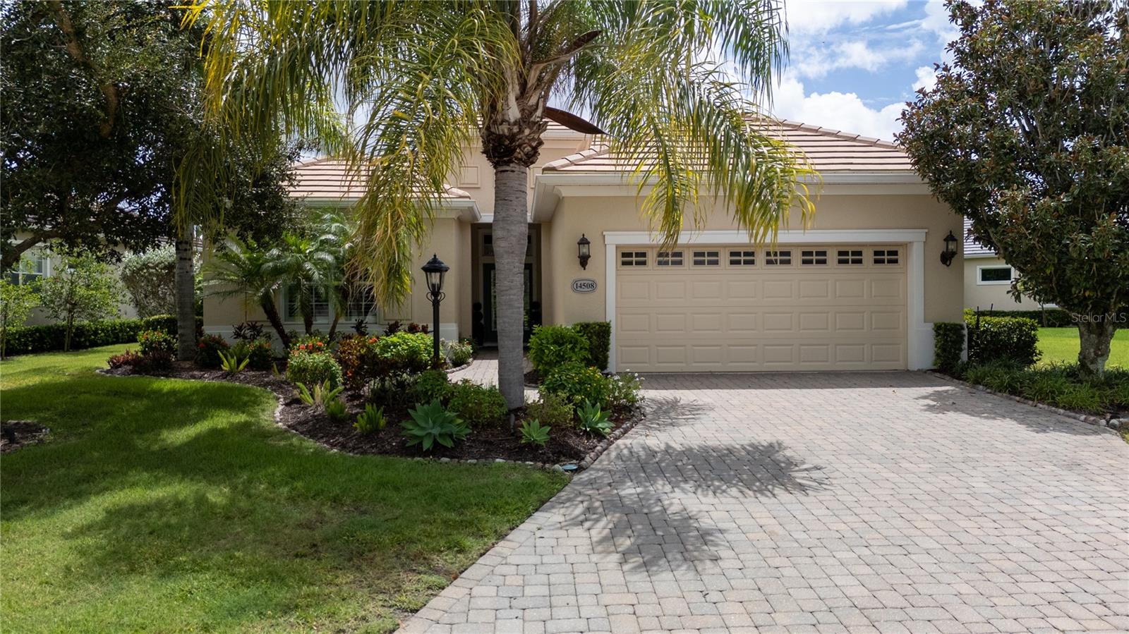 Experience refined Florida living in this elegantly updated maintenance free residence within the prestigious gates of Lakewood Ranch Country Club East. Perfectly positioned on over a quarter acre with serene pond and golf course views, this Neal-built Windsong floor plan blends timeless design with modern comfort.
A leaded glass entry and tile-inset foyer welcome you into an open, light-filled living space highlighted by trayed ceilings, crown molding, plantation shutters, and custom niches. Fresh interior paint, designer lighting, and exquisite tile flooring set a sophisticated tone.
The gourmet kitchen serves as the heart of the home, boasting rich wood cabinetry with glass accents, granite countertops, a stylish backsplash, and stainless-steel appliances. A den with French doors and wood flooring offers an ideal home office or reading retreat.
Three spacious bedrooms include a luxurious owner’s suite with private French door access to the lanai, where a heated saltwater pool and spa create a tranquil oasis for entertaining or unwinding. Pocketing sliders seamlessly connect indoor and outdoor living.
Energy-efficient features include a new 2025 AC, gas tankless water heater, radiant heat barrier, and insulated double-glazed windows. An oversized two-car garage adds convenience.
Belleisle residents enjoy their own community pool, spa, clubhouse, and recreation amenities, along with exclusive access to The Retreat—featuring a resort-style pool, fitness center, game room, and more. Membership at Lakewood Ranch Country Club provides additional dining, golf, and social opportunities.
Consistently ranked among the top master-planned communities in the nation, Lakewood Ranch offers a lifestyle of elegance, recreation, and serenity. This move-in-ready residence invites you to embrace paradise today.