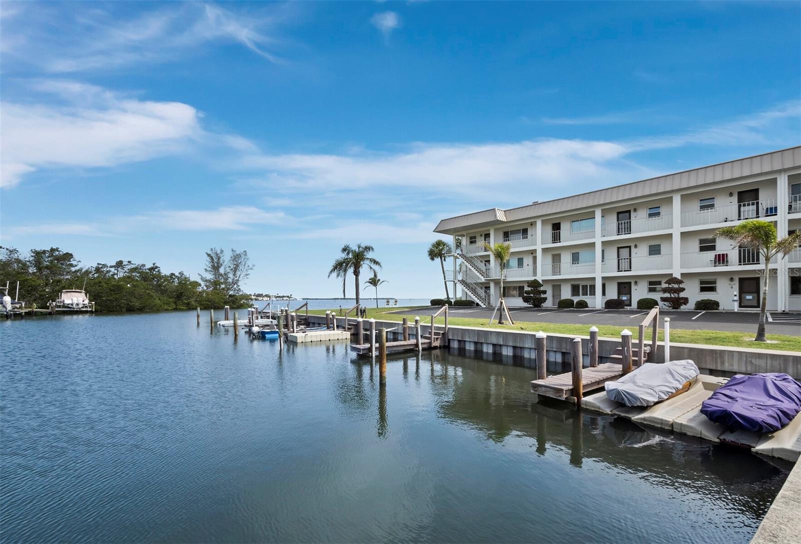 Offered at $599,000!
Well below market value, this stunning residence presents an incredible opportunity to experience the coveted Longboat Key lifestyle.
Welcome to your completely renovated coastal retreat, bright, airy, and beautifully designed to capture breathtaking water views of Crane’s Bayou, Buttonwood Harbor, and Sarasota Bay. Natural light fills every corner of this end-unit condo, creating an inviting and serene atmosphere throughout.
The designer kitchen features elegant quartz countertops and contemporary finishes, flowing seamlessly into a spacious, sunlit living area perfect for relaxing or entertaining. The home offers two generous bedrooms and two fully-up-to-date bathrooms, including a luxurious primary suite with a walk-in closet and spa-inspired en-suite bath adorned with high-end fixtures.
Recent upgrades include hurricane-impact windows (2024), a new AC system, and a new water heater, ensuring comfort, efficiency, and peace of mind for years to come.
Residents of Longboat Arms enjoy exceptional waterfront amenities, including a newly upgraded heated pool, clubhouse, tennis courts, community grill area, and DEEDED BEACH ACCESS just across the street. Exclusive access to a private boat ramp makes it ideal for kayaks, paddleboards, jet skis, and all watercrafts. Boat docks are also available on a first-come, first-served basis for an annual fee—perfect for boating enthusiasts who want to embrace the best of Gulf Coast living.
Don’t miss this rare opportunity to own a beautifully updated condo with spectacular views. Offered at just $599,000, well below market value!