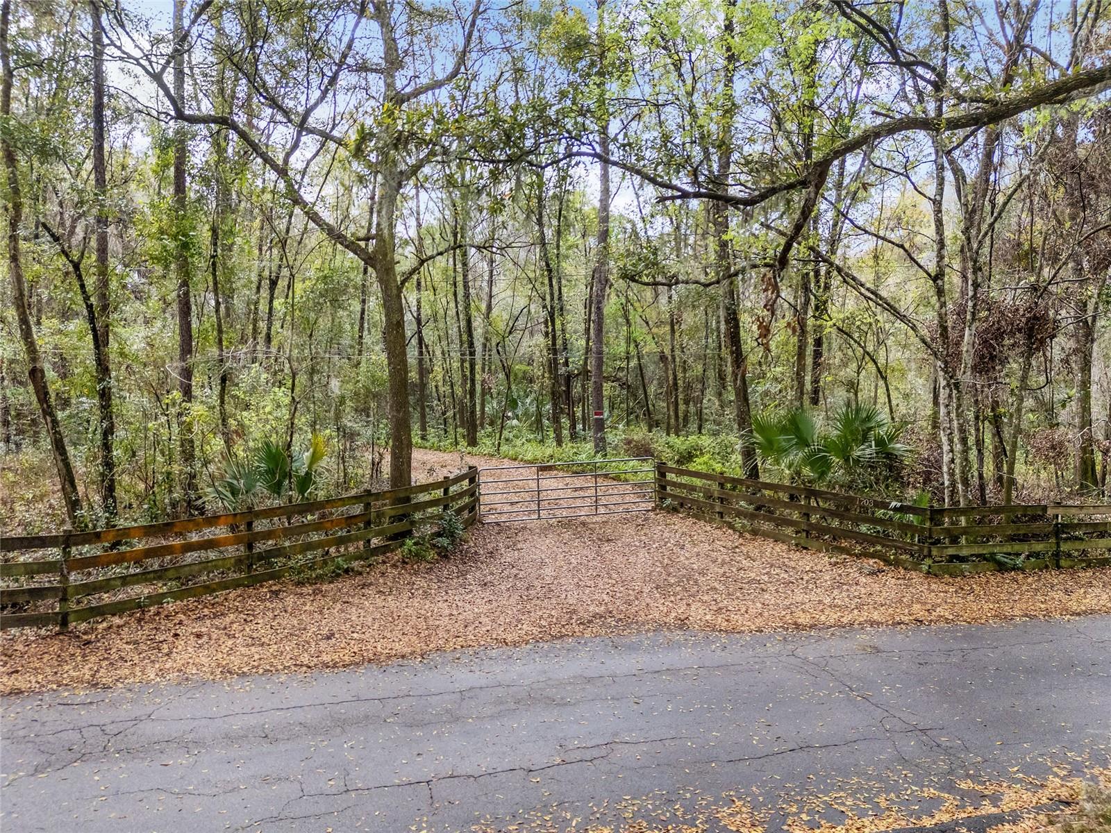 Exceptional development opportunity near the University of Florida! Prime location less than 2 miles from UF/UF Health Shands Hospital, this 10.82-acre property is comprised of three parcels, offering unmatched flexibility for development. The two primary parcels (5.01 acres and 5.52 acres) are high and dry, and zoned R1-A, allowing for a range of possibilities with 2-4 dwellings per acre and city water and electric on property. The third parcel (.29 acres) provides deeded lake access to Bivens Arm, extending into the heart of the lake—perfect for canoeing, kayaking, or enjoying serene water views. Just minutes to Butler Plaza, offering extensive shopping, dining, and entertainment options. Easy access to Downtown Gainesville’s vibrant cultural and nightlife scene. Close proximity to nature parks, walking trails, and recreational spots, enhancing lifestyle appeal. With nearby amenities, and the unique lake access this property creates significant potential for strong long-term investment returns. *Note: red arrows and property outlines are approximate, buyer to verify with property survey.