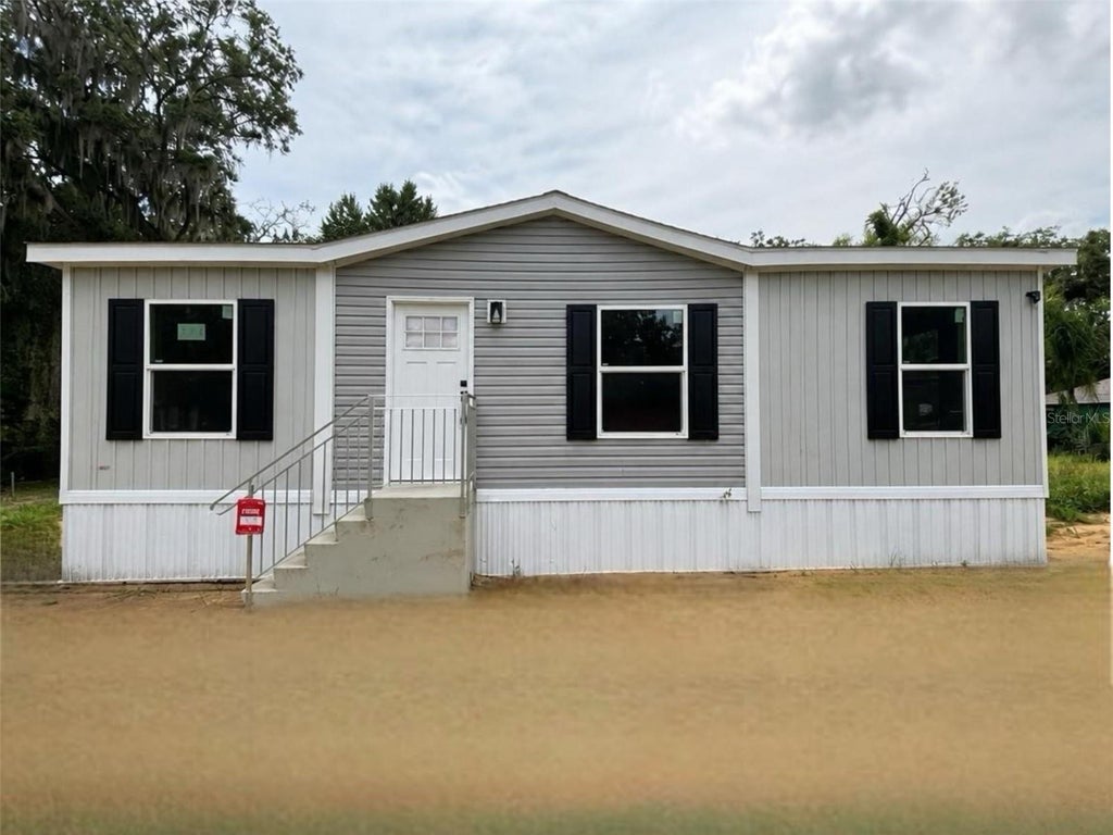 Photo of 175 Smith Street, Mulberry, FL 33860 (MLS # A4700435)