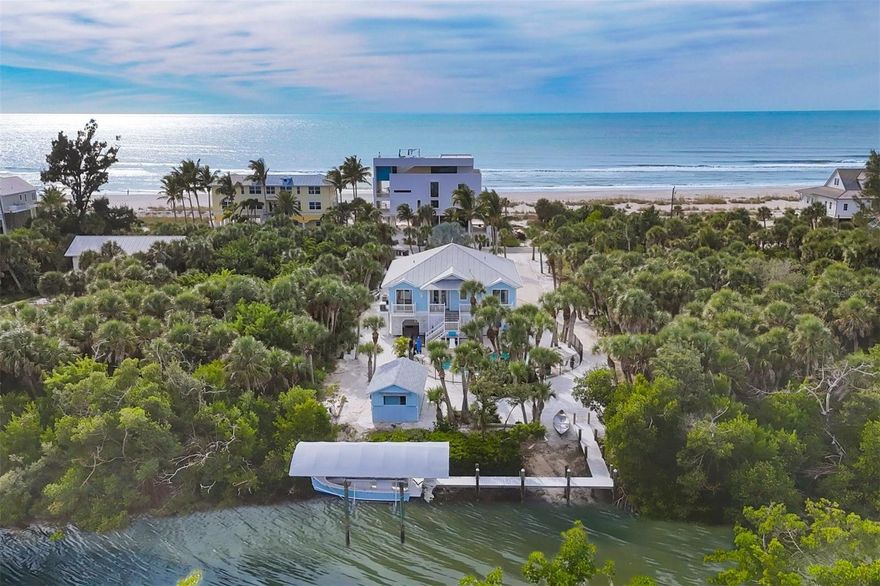 PALM ISLAND 3 BED 3 BATH POOL HOME WITH DOCK AND LIFT ON A DOUBLE LOT WITH NO HOA!  Situated on a paved road  with deeded beach access directly across the street. Located on a barrier island with car ferry access, this elevated home is easily accessible by elevator as well as front and rear staircases! Enter into a large living, dining and kitchen area with wood flooring and 10-foot ceilings.  The master bedroom has an en-suite bath and walk-in closet. All three bathrooms have been renovated with porcelain flooring and glass enclosures with tiled showers. Enjoy a meal or cocktail in the screened lanai with Storm Smart electric shutters while overlooking the beautiful gulf waters and sunsets!  Lounge around the heated pool, walk the quiet beaches of Palm Island or visit Rum Bay Restaurant in Palm Island Resort, just a short walk or golf cart ride away! For the boater, the dock is equipped with a covered 10,000Lb lift and is located on a protected canal, with no bridges to the ICW and Gulf! In addition, there is a shed offering substantial storage as well as an enclosed golf cart garage. The first level has plenty of room for two covered vehicles as well as your beach toys. The home equipped with a house generator powered by propane.