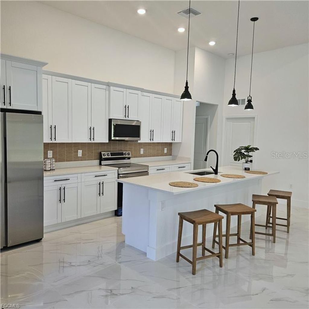 Photo of 113 Monroe Avenue, Lehigh Acres, FL 33936 (MLS # A4686406)