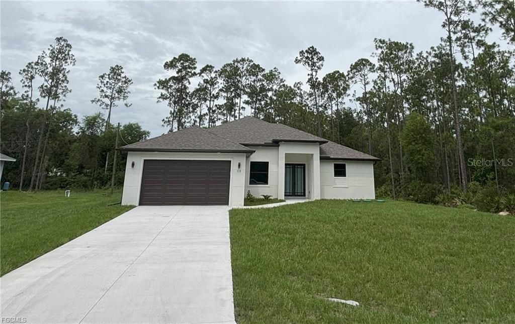 Photo of 113 Monroe Avenue, Lehigh Acres, FL 33936 (MLS # A4686406)