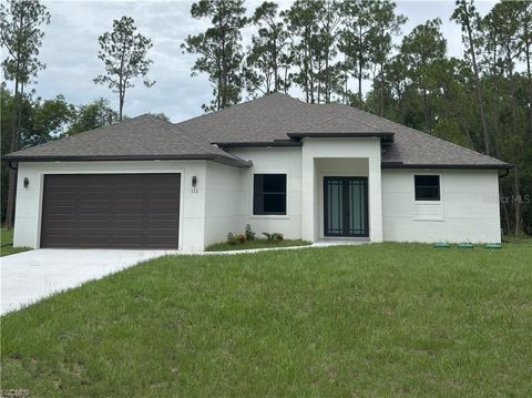 Photo of 113 Monroe Avenue, Lehigh Acres, FL 33936 (MLS # A4686406)