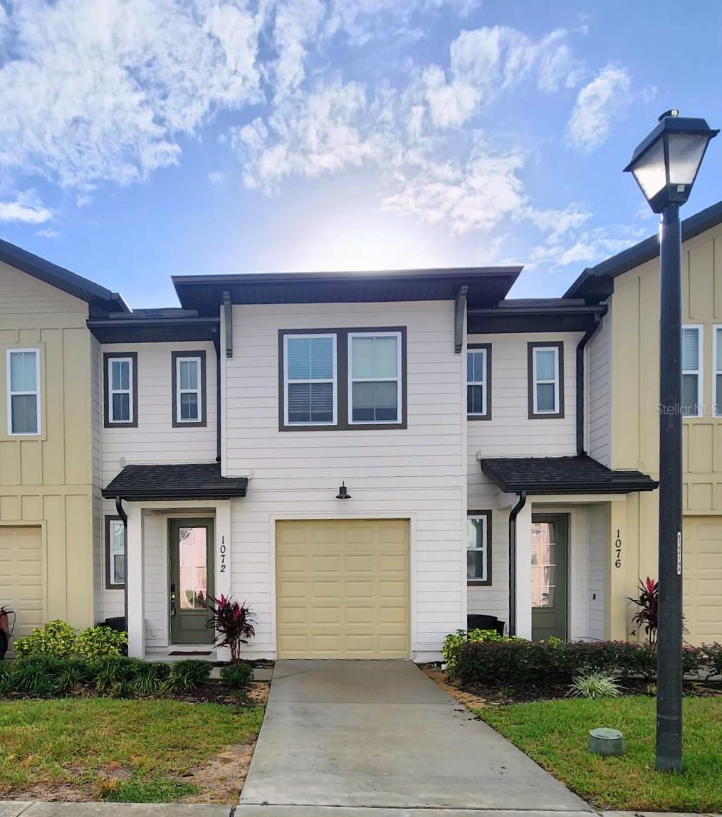 Enjoy the comfort and convenience of this beautiful, fully furnished, renovated, and well-maintained townhome located in the desirable Festiva community. This spacious 3-bedroom, 2-bathroom unit is move-in ready and thoughtfully designed for comfortable living. It features an open-concept layout with a kitchen overlooking a combined living and dining area, ideal for entertaining. Quality furnishings throughout the home include a spacious master suite with a walk-in closet and private bathroom with dual sinks and a walk-in shower. Guest bedrooms are comfortably furnished and versatile for guests or as a home office. Tenant is responsible for water, electricity, and internet. Festiva's resort-style amenities include a sparkling community pool with a splash pad, miniature golf, a fully equipped fitness center, a fun-filled game room, and a charming ice cream shop. Location: Conveniently located in Davenport, close to shopping, restaurants, attractions, and easy access to I-4. Whether you're relocating or simply looking for a carefree living experience, this townhome has everything you need. Just bring your suitcase and settle in!