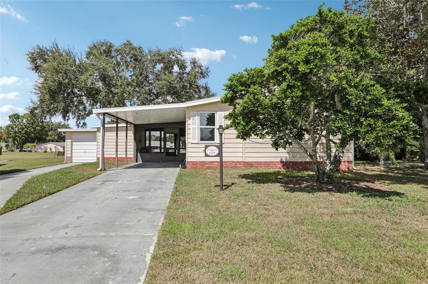 ATTENTION GOLF LOVERS!!!  Partially Furnished 2/2 GOLF FRONT HOME on a PIE-SHAPED LOT with a GOLF CART GARAGE on the Orange Blossom Championship Golf Course in The Villages!!!  Surrounded by MATURE LANDSCAPING, this lovely, well-maintained home is located on a PEACEFUL CUL-DE-SAC on the Historic Side of The Villages.  Enjoy BREATHTAKING PANORAMIC VIEWS of one of THE most picturesque golf courses from your back patio or from the Florida Room which has a built-in wet bar and an electric fireplace.  New, light gray laminate flooring throughout the home brightens up the entire living space.  NO CARPET.  There are also newer windows, a newer AC (2022) and water heater (2023).  2009 Yamaha Gas Golf Cart and some furniture are negotiable.  Enjoy this piece of paradise and all the WORLD-CLASS AMENITIES that The Villages is famous for: golf, pickleball, tennis, pools, classes and activities at the recreation centers and nightly live entertainment to name just a few!  Schedule your private showing today!