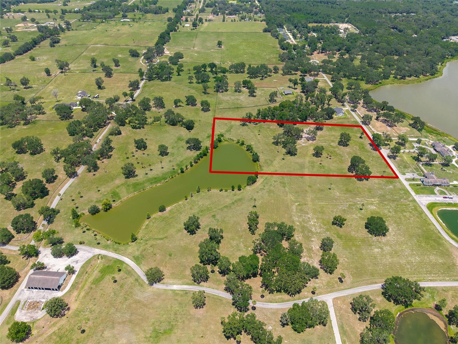 One of the most stunning pieces of land available in Silver Leaf Hills and ready to build your dream home or horse ranch in the same neighborhood as the 2024 Kentucky Derby winner! This property has a well and 4 board fencing. Enjoy your full stocked shared pond, with frequent visitors of neighboring otters, gators, turtles, birds of prey, turkeys and tilapia. Embark on a unique equestrian adventure with this unparalleled opportunity to acquire a majestic plot within the newly established Silverleaf Hills - a pristine, gated Equestrian Community that breathes sophistication and functionality for horse lovers, your dream equestrian lifestyle is within arm’s reach. Silverleaf Hills, gracefully unfolding over 765 acres, with riding bridle trails and deeded access throughout the whole community, unveils an enchanting canvas of rolling hills, crystalline spring-fed lakes, and mesmerizing views that serve as the backdrop for your equestrian endeavors. The community boasts secure gated access, meticulously paved streets, underground utilities, and sensible deed restrictions, encapsulating a harmonious blend of beauty and convenience. The interior boasts a beautiful fully stocked pond, ready for a dock or a fountain. This property has a neighboring lot that is also available surrounding a total of two thirds of the pond with a total acreage once combined of just over 20 acres. The property invites you to immerse yourself delightful embrace of nature with majestic Granddaddy Oaks sprinkled across the landscape, while the community allows for the construction of barns prior to residences, truly reflecting its equestrian-centric vision. Positioned strategically, Silverleaf Hills offers swift connectivity to equestrian landmarks, being a mere 25-minute drive from the World Equestrian Center in Ocala, 10 minutes from the revered Florida Horse Park, and conveniently adjacent to The Villages, Florida. With entrances accessible from both US 301 and Hwy 42 the property promises ease of access for its future owners. Within this extraordinary community, observe the rise of elegant custom homes, each echoing a narrative of luxury and style, with several currently under construction. Engage in tranquil horse rides with over the whole property's bridle path easements dedicated for your riding delight, and revel in a setting where every detail is meticulously crafted, reflecting a commitment to excellence in equestrian living. This must-see property is not just a piece of land; it is a gateway to a refined equestrian lifestyle where your vision of a perfect equestrian home can come to life amidst a community that shares your passion and sophistication.
Seller financing may be available to qualified buyers. 8% interest 2-3yr balloon 20yr amortization with at least 65k down payment to seller.