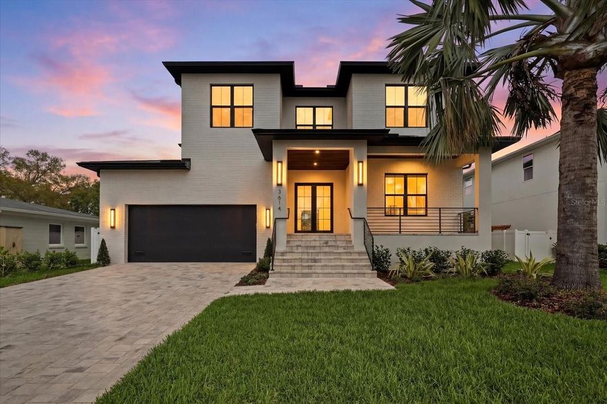 Beautifully custom built two story block construction in the desirable in Bel Mar shores. This 4,596-square-foot new construction residence was designed to impress from the moment you arrive. With 5 bedrooms, 5.5 bathrooms, and a 2-car garage, the home blends strong construction with elevated, modern design.

Step inside to high ceilings and a bold Venetian plaster statement wall that immediately draws you into the open living space. The main level unfolds into a stunning open-concept kitchen and living area, where form meets function in every detail.

The kitchen is the heart of the home, featuring custom cabinetry, Thermador gas appliances, and a generous oversized island made for gathering. The living room is anchored by a sleek fireplace and framed by four expansive sliding glass doors, creating a seamless connection to the outdoors.

Outside, the home truly comes alive. A covered rear porch with Synergy tongue-and-groove ceiling, gas grill, and hot tub create an inviting setting for entertaining, relaxing, and enjoying Florida living year-round.

The first floor also offers a private office and a guest suite with its own bathroom, providing flexibility for work, visitors, or extended stays.

Upstairs, the primary suite feels like a private retreat, complete with a spa-inspired bath and an expansive walk-in closet with a center island—every closet goal realized. All additional bedrooms feature en-suite bathrooms with quartz countertops, offering comfort and privacy throughout.