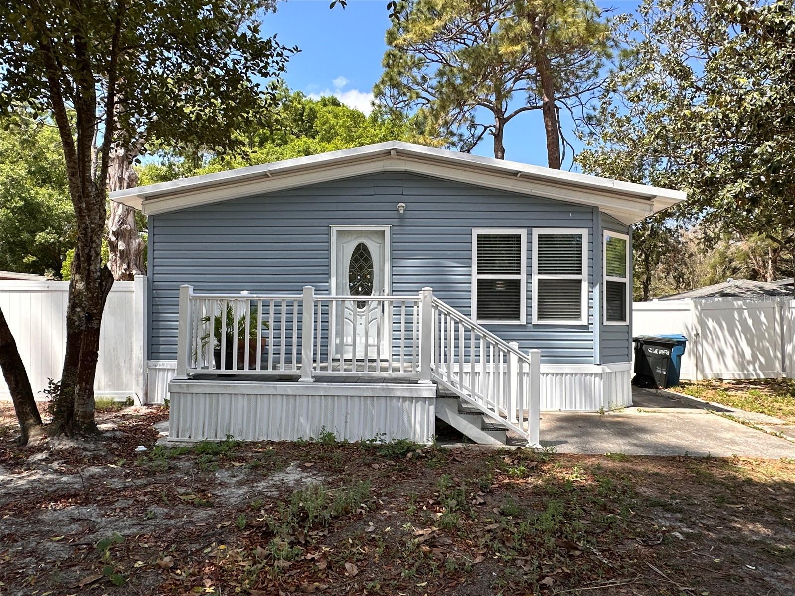 Located in the Masaryktown Community, close to 41, Veterans Expressway, and Spring Hill. Upon arriving at the property, you'll be welcomed with mature trees that provide shade and an atmosphere of tranquility. The property offers 2 bedrooms and 1 bath in an open layout design with a living room/dining combo. Kitchen features solid wood countertops and an island for extra counter space. Front and Back deck for added space and a fenced back yard. To the right of the house, you have a double gate for better access to the back or the
