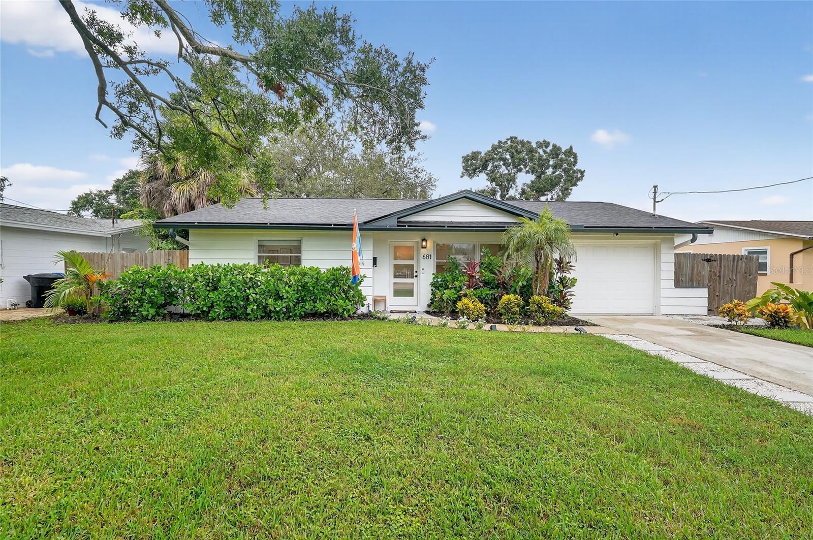 This 2-bedroom, 1.5-bathroom St. Pete home has been completely updated and is move-in ready, offering modern comfort. With a brand-new 2025 roof, 2022 AC unit, new plumbing, all-new windows, and an awesome outdoor shower, this property seamlessly blends peace of mind with contemporary design. The property also includes a fully renovated and livable ADU with AC, complete with electric, fresh paint, new flooring, and a ceiling fan - ideal for guests or a home office. Step inside to find wood-look vinyl flooring, a spacious living room with new ceiling fan, and a living/dining room combo highlighted by a modern light fixture. The bright kitchen features quartz countertops, stainless steel appliances, a new sink and fixtures, tons of cabinet storage, and open built-in shelving. The primary bedroom includes a custom built-in closet and vanity, while the spa-like bathroom boasts a new vanity, mirror, fixtures, lighting, and a rain showerhead. Additional living space can be found in the back family room, perfect for relaxation or entertaining. Out back, enjoy the Florida lifestyle with a patio for dining and grilling, an outdoor shower, and a large fenced backyard oasis. Located near 4th St N dining, shopping, and parks, with quick access to I-275 for easy travel, and less than 15 minutes to downtown St. Pete’s restaurants, breweries, and events, this home offers both convenience and charm. Schedule your private showing today!