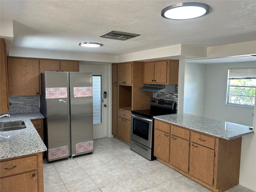 Photo of 5724 Mosaic Drive, Holiday, FL 34690 (MLS # TB8460064)