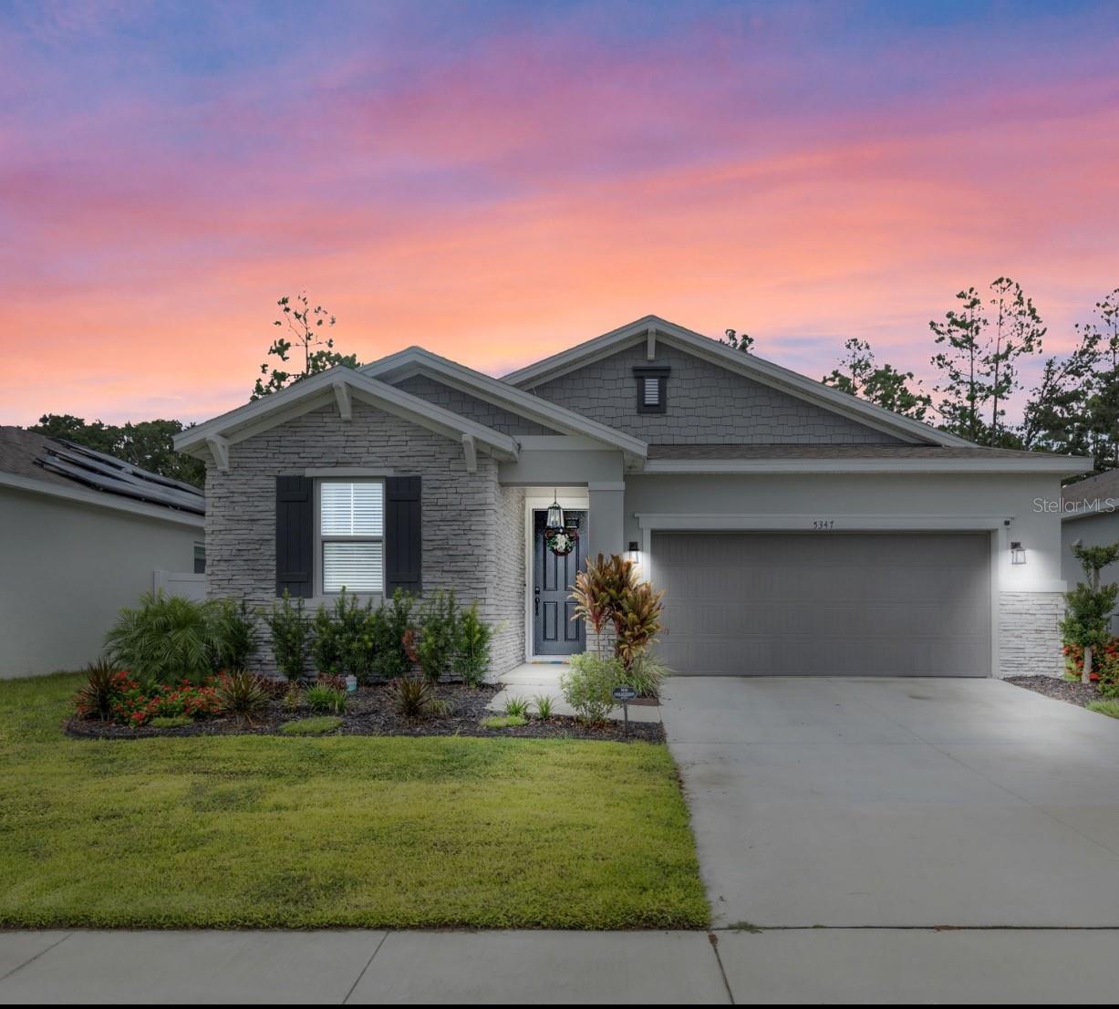 Welcome to this stunning 2023 pool home in the desirable Spring Creek community. This move-in ready 3 bedroom, 2 bathroom home features an open layout where the kitchen, dining, and living areas flow seamlessly beneath 9-foot ceilings, creating a bright and spacious atmosphere.
The kitchen is equipped with solid wood cabinets, quartz countertops, stainless steel appliances, and a gas-burning stove, making it ideal for anyone who enjoys cooking. Step outside to the BRAND NEW POOL, completed in July 2025, set against a wooded backdrop that offers both privacy and tranquility.
Energy efficiency comes built-in with FULLY OWNED solar panels, keeping utility costs low year-round. The split-bedroom floor plan provides a private owner’s suite with a spa-like bath featuring double vanities, while the two secondary bedrooms are located on the opposite side of the home for added privacy.
Additional highlights include a two-car garage for storage and convenience, plus a prime location close to shopping, dining, and outdoor activities throughout Central Florida.
With its high ceilings, modern finishes, energy savings, and poolside retreat, this home combines comfort, style, and function in one exceptional package. Schedule your showing today.