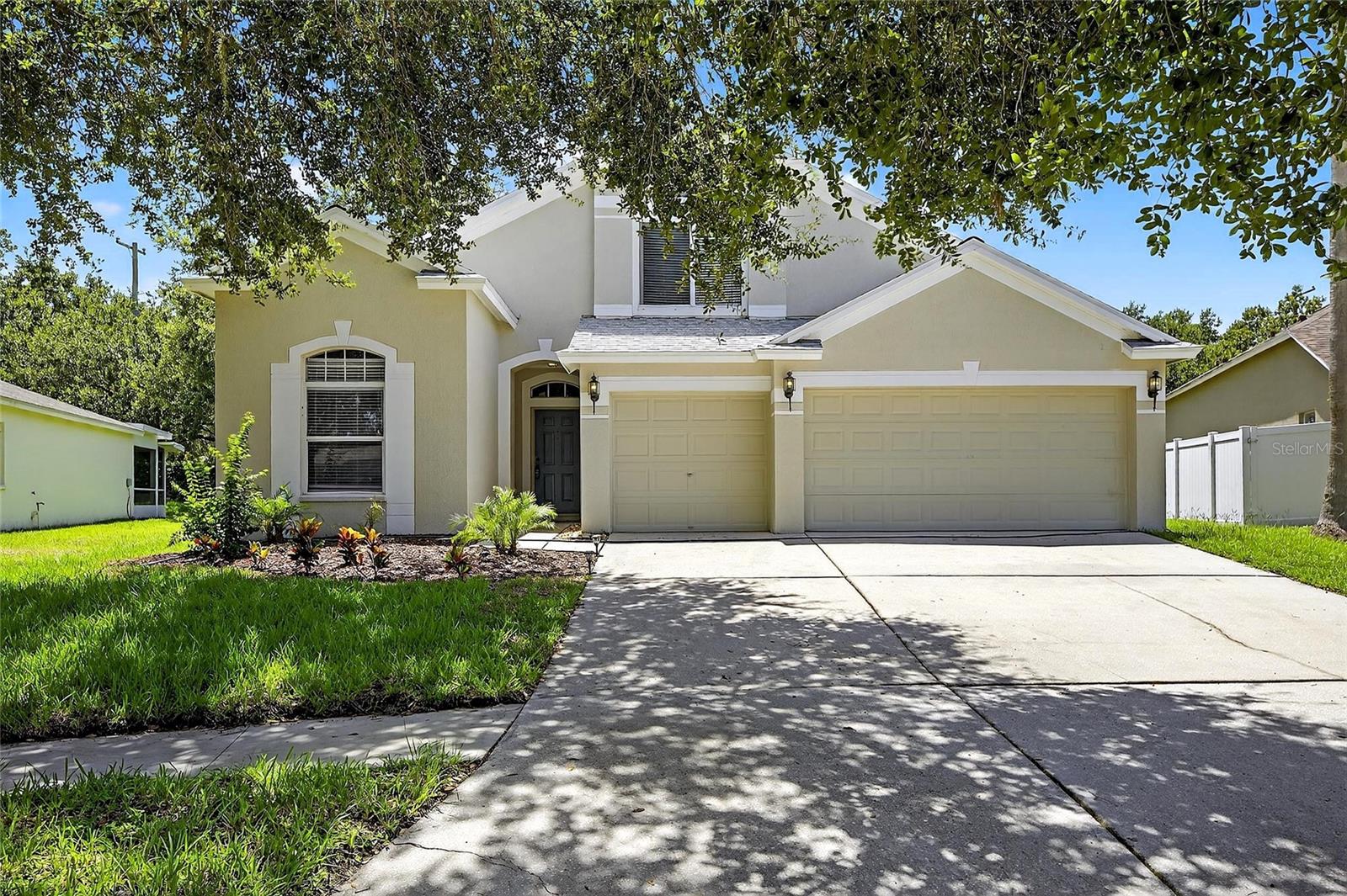 One or more photo(s) has been virtually staged. Discover this exceptional family home boasting 5 bedrooms and 4 bathrooms, complemented by a spacious 3-car garage. The interior features fresh paint, new flooring throughout, and refreshed ceiling fans and light fixtures that enhance its overall appeal. Enjoy the convenience of having the majority of the bedrooms and baths on the main floor, including a luxurious Primary Suite, all thoughtfully arranged in a tri-split layout for optimal privacy. An additional bedroom and a full bathroom are conveniently located upstairs, making this home ideal for family living and guests. Step outside to a covered lanai and an extended, screened patio with plenty of room for outdoor entertaining. Bloomingdale Cove offers its residents a private, gated park with trails leading to the Alafia River, and the Bloomingdale community is known for its large parks, playgrounds, local baseball fields, and the Campo YMCA. Along with nearby shopping and restaurants, you'll appreciate all this area has to offer. Thank you for your interest and for taking the time to see this home in person.