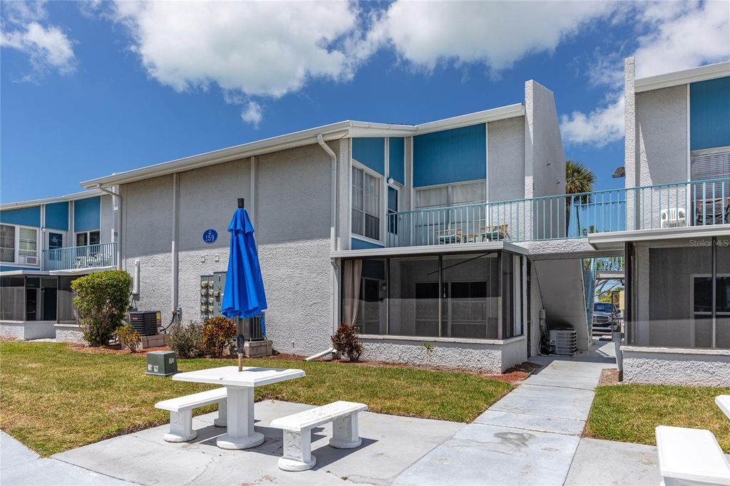 Photo of 159 Medallion Boulevard #H, Madeira Beach, FL 33708 (MLS # TB8497602)
