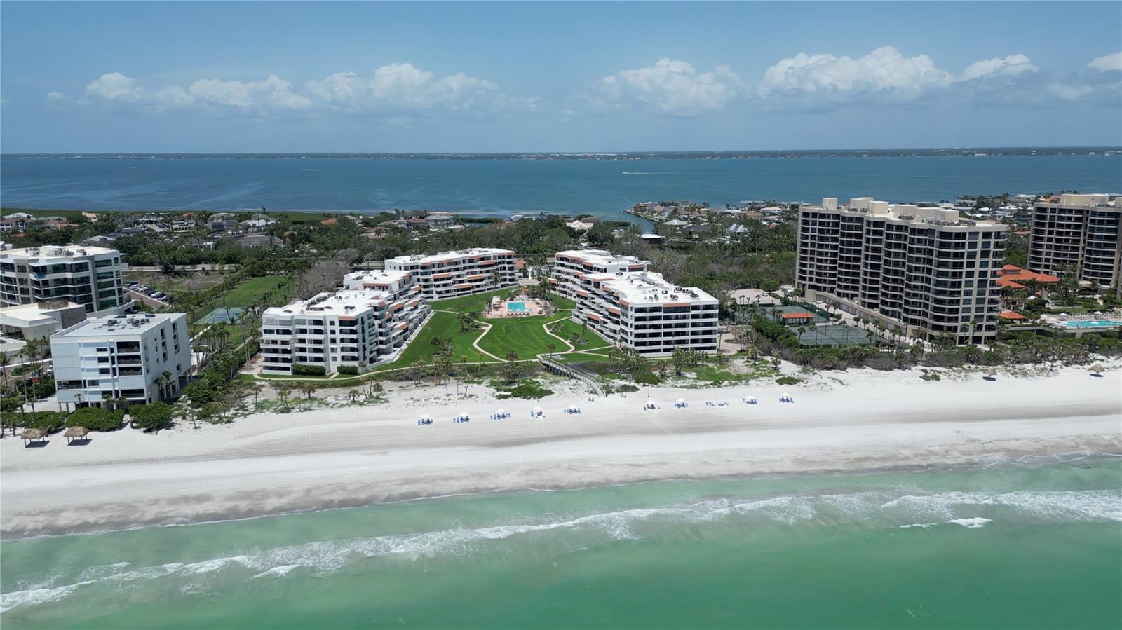 Timeless sophistication meets resort-style elegance in this fully renovated 3-bedroom residence at the coveted Players Club on Longboat Key. Ideally situated on the sought-after south end of the island, this home places you moments from the prestigious St. Regis Hotel, the Longboat Key Club, Publix, and the upscale dining, boutique shopping, and cultural attractions of St. Armands Circle and downtown Sarasota.
From the moment you enter, Gulf views and refined design elements set the tone. A complete interior transformation includes all-new flooring and doors throughout, freshly painted trim and doors, and upgraded Baldwin hardware and hinges. The expansive living area now showcases oversized marble tile, enhancing the natural light and coastal ambiance.
The kitchen has been reimagined with quartz countertops, new backsplash, sink, faucet, and cooktop, plus a more open layout created by a partial wall removal. A redesigned dry bar with new cabinetry and dual beverage coolers makes entertaining effortless.
Both guest and master suites have been thoughtfully upgraded. The guest bath features a new vanity faucet, mirror, sconces, shower glass, wallpaper removal, and polished nickel trim, while the guest bedroom’s bath is brightened with new lighting and fixtures. The primary suite serves as a private retreat with new floor tile, freshly painted walls, updated plumbing fixtures at the sinks, shower, and tub, custom California closets, and direct terrace access.
Additional updates include all new electrical, a new washer, a new HVAC system, and fresh quartz countertops throughout the kitchen and baths — giving buyers peace of mind and a truly move-in-ready experience.
Designed for effortless indoor-outdoor living, the living room, kitchen, and master bedroom all open onto a sprawling terrace, where sweeping views of lushly landscaped grounds and the sparkling Gulf of Mexico provide an inspiring backdrop.
Life at the Players Club is defined by luxury and leisure, with an impressive array of amenities including a newly renovated clubhouse with a state-of-the-art fitness center, library, catering kitchen, and both indoor and outdoor gathering spaces. Residents also enjoy four Har-Tru tennis courts with pickleball capabilities, a 70-foot heated saltwater pool and spa, beautifully maintained tropical grounds, deeded beach access, and the peace of mind of 24/7 gated security and on-site management.
This residence is being offered furnished (with a few personal exclusions) and includes under-building assigned parking, convenient bike racks, and a private storage closet just outside the front door.
With its comprehensive renovations, prime location, and access to premier resort-style amenities, this Players Club residence presents a rare opportunity to experience the very best of Longboat Key’s coastal lifestyle.