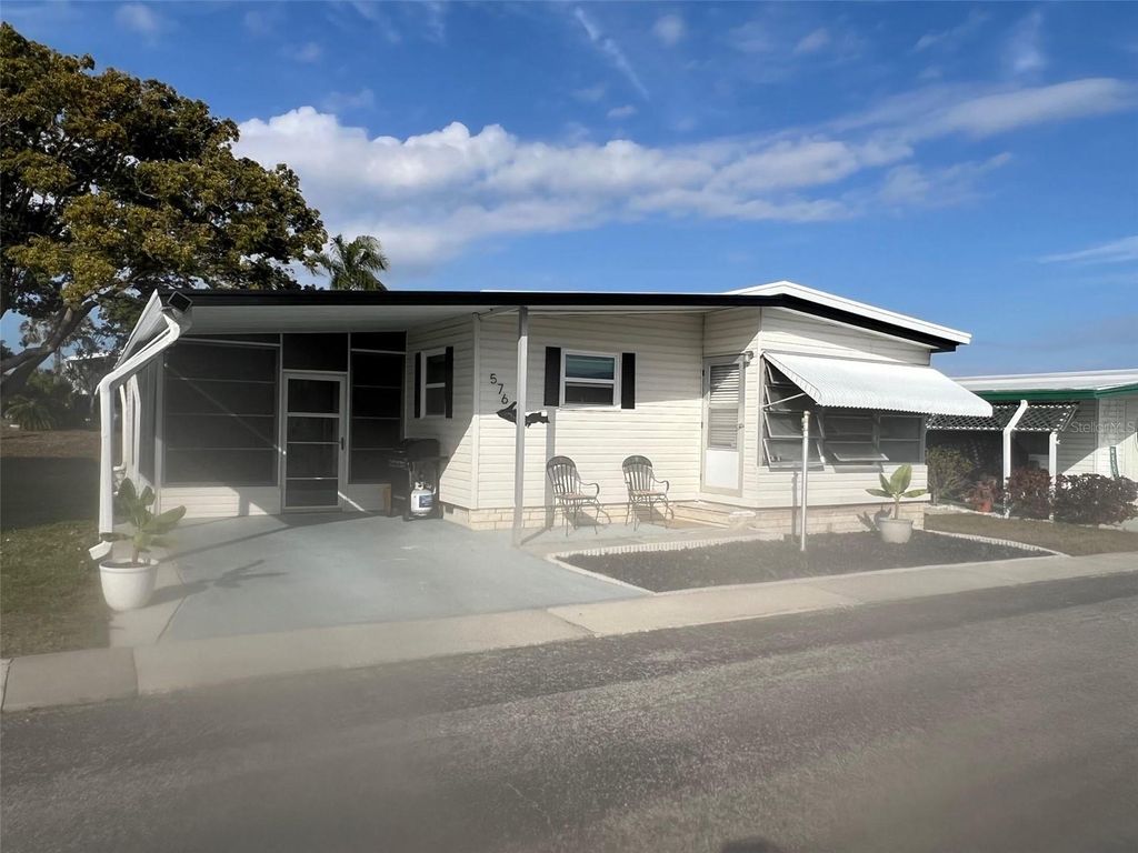 Photo of 576 Queen Palm Street, Largo, FL 33778 (MLS # TB8464802)