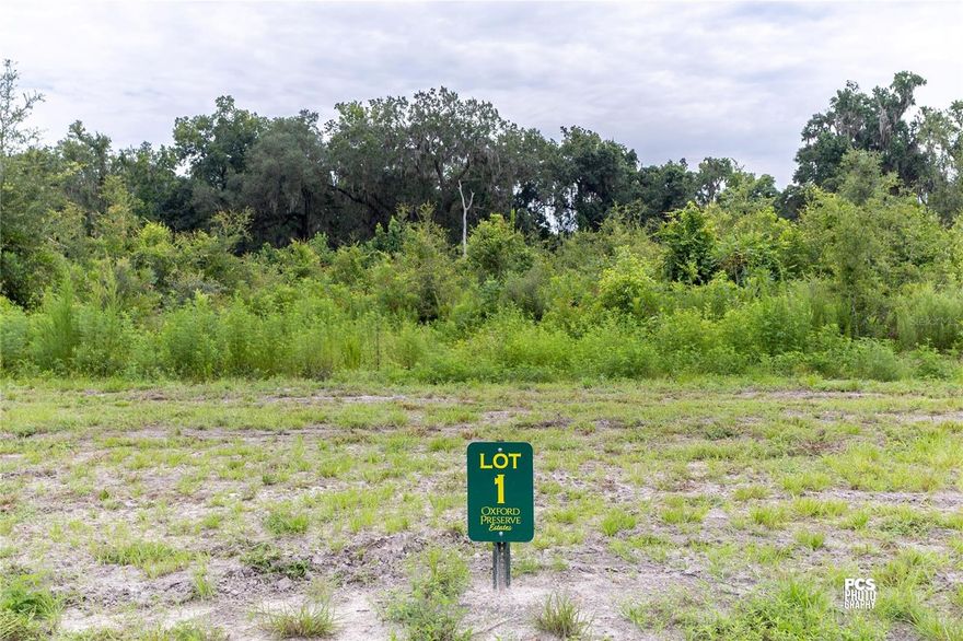 Experience luxury living infused with county charm in the exclusive, privately gated community of Oxford Preserve Estates.  With only 20 estate lots set on 5-8+ acre parcels of land, each is unique featuring pristine, wooded land highlighted by majestic native Live Oaks, graceful palmetto, and scrub oaks. Designed with both elegance and natural beauty in mind, all utilities are discreetly placed underground, preserving the serene landscape while offering modern convenience. There is no set timeframe for building your custom dream home, giving you the freedom to choose your own builder and craft a residence that perfectly suits your lifestyle. Public utilities are robust and reliable, including high-speed Spectrum internet and dependable SECO electric service, while private utilities such as well and septic systems are managed individually by each lot owner. Home designs are thoughtfully mandated to ensure spacious living, with one-story homes requiring a minimum of 2,400 square feet and two-story homes needing at least 1,800 square feet on the first floor. Adding to the appeal is an affordable HOA yearly assessment of less than $800, which helps maintain the community’s pristine condition. Ideally located, this neighborhood offers true Florida living at its finest, with the convenience of being less than a 10-minute drive from essential amenities including The Villages Charter School, Super Walmart, Publix, Costco, Chick-Fil-A, Lake Sumter Landing, Home Depot, Lowes, and churches.