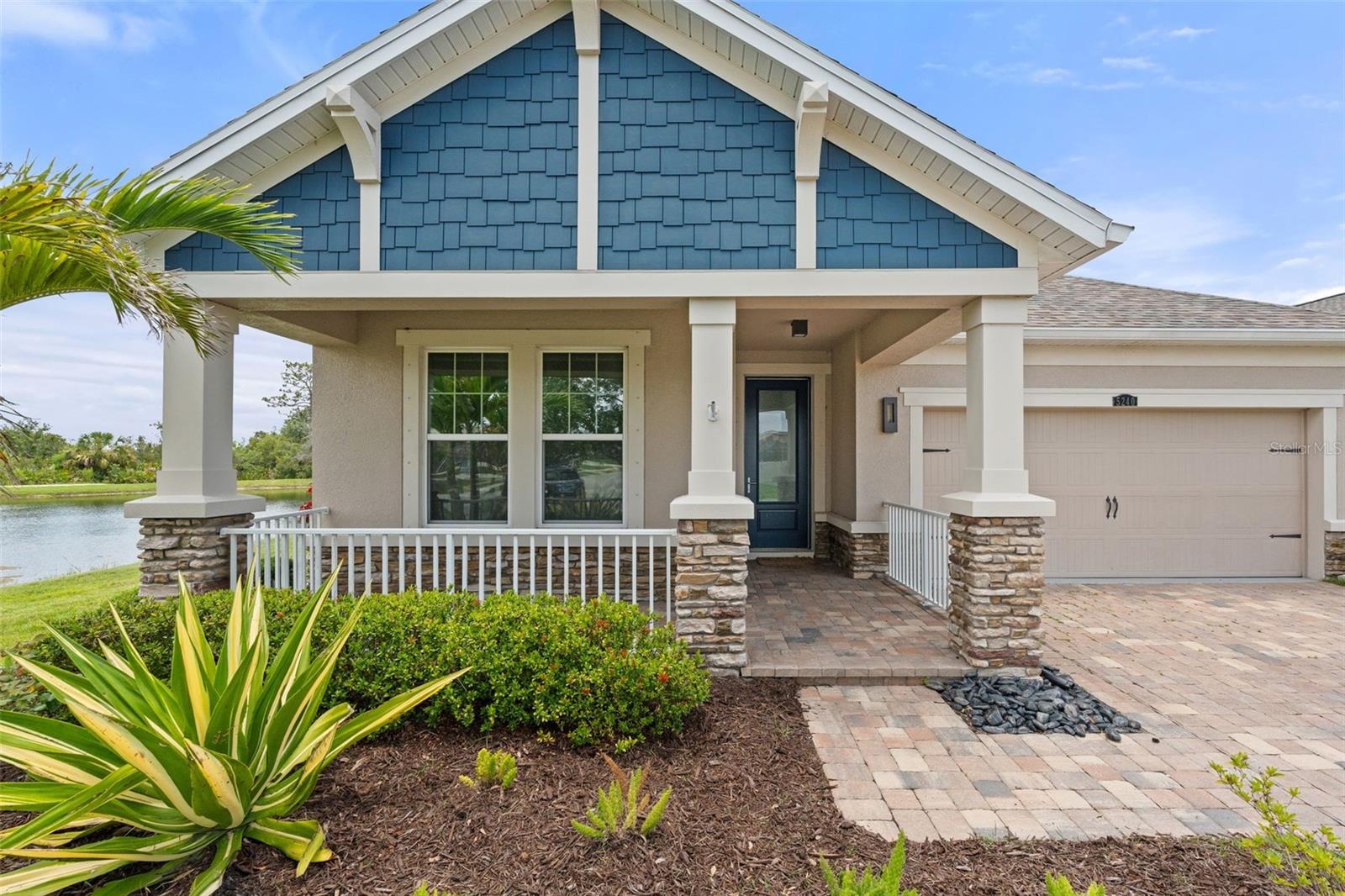 Welcome to 5240 Bentgrass Way, a stunning contemporary pool home nestled on a private lot with serene pond and preserve views in the heart of Lakewood Ranch. Designed with a European flair and filled with luxurious upgrades, this beautifully maintained residence blends modern elegance with everyday comfort, creating a truly move-in-ready oasis. You will have peace of mind with a 2022 roof, a 2025 AC unit, and a 2025 water heater!
Step through the elegant glass front entry into an airy, open-concept layout filled with natural light and designer touches throughout. The custom gourmet kitchen is the centerpiece of the home, boasting sleek Italian soft-close cabinetry, built-in stainless steel appliances, a full-wall designer tile backsplash, and a large center island with a breakfast bar accented by stylish pendant lighting—perfect for casual meals or entertaining guests.
The expansive great room flows effortlessly to the screened lanai, where you’ll discover a private PebbleTec saltwater pool with soothing waterfall features, surrounded by peaceful pond and preserve views. A covered outdoor living area makes this space ideal for year-round relaxation and entertaining.
The owner’s suite is a luxurious retreat with a spacious walk-in closet and spa-style bath featuring an oversized river rock tile shower with seamless glass enclosure, a soaking tub, dual vanities, and custom built-in mirrored cabinetry offering generous storage. Three additional bedrooms include a Jack-and-Jill bathroom, providing privacy and flexibility for guests or family members.
Other upgraded touches include a custom laundry room with built-in cabinetry, custom drying rack, farmhouse sink, barn door, and front-load washer/dryer, a two car garage with epoxy floors, tray ceilings, upgraded lighting, and tiled accent walls.
Living in Harmony at Lakewood Ranch means enjoying low HOA fees that include exterior lawn maintenance and access to fantastic amenities like a resort-style pool, clubhouse, fitness center, outdoor grilling stations, cabanas, a playground, and the Harmony walking trail. Perhaps the best part though, Harmony boasts arguably the most convenient location in all of Lakewood Ranch. You’re just minutes from top-rated schools, multiple grocery stores, shopping, dining, healthcare facilities, and have quick access to I-75, making travel to Sarasota, Tampa, and beyond a breeze. Plus, you’re only 20 minutes from the powdery sand beaches of Florida’s Gulf Coast.
Don’t miss the opportunity to make this exceptional home yours!