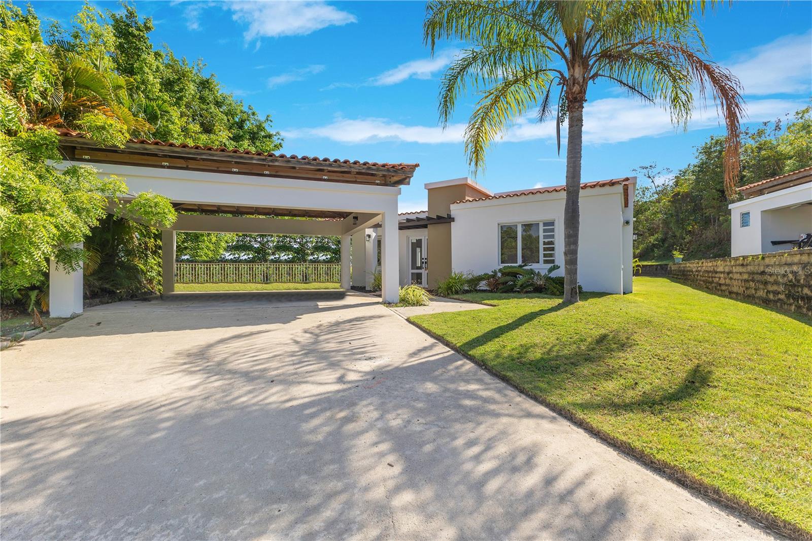 Elegantly remodeled and fully furnished, this beautiful one-level single-family residence sits on a desirable corner lot within the exclusive Palmas del Mar community. Offering 3 spacious bedrooms and 2 full bathrooms, the home features a bright open-concept layout that seamlessly connects the living and dining areas, ideal for both relaxing and entertaining. Enjoy two outdoor sitting areas perfect for unwinding or hosting guests, and convenient proximity to the complex pool area.
As a resident of Palmas del Mar, you’ll have access to a world-class array of resort-style amenities, including over 15 restaurants, a vibrant town center with shops, banks, and spa services, Palmas Academy, an equestrian center, yacht club marina, scenic walking and biking trails, over 3 miles of pristine beachfront, 24/7 private security, two 18-hole championship golf courses, a tennis club, and the oceanfront Beach Club with on-site dining. A rare opportunity to enjoy luxury living in one of Puerto Rico’s premier resort communities.