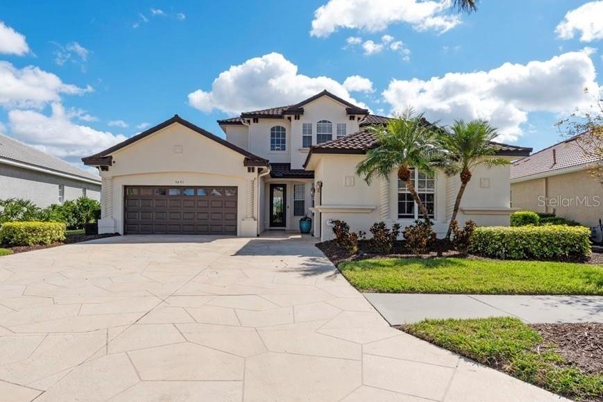 Discover the epitome of luxury living at 5241 Grand Palmetto Way! This exquisitely updated POOL HOME is located on one of the most coveted sites in Heron Creek, within the Quail Run section just north of Price Blvd. Positioned perfectly on the 8th hole of the Creek 9, the backyard offers over 70 FEET OF SERENE WATERFRONTAGE and an unobstructed 180° panorama of the nearly 2-acre pond and picturesque NATURAL MARSH PRESERVE.
This spacious home features 4 bedrooms (including a lower-level master suite), an office, and 3 bathrooms, providing over 3,100 sq.ft. of living space—ideal for those needing the extra room! The expansive 1,200+ sq.ft. caged pool area, along with TWO SEPERATE GARAGES adjacent to the private front entrance courtyard and terrace, offers ample space for outdoor enjoyment.
Recent upgrades include a NEWER STONE COATED METAL ROOF with a barrel tile appearance (installed in February 2024) and a FULLY RENOVATED KITCHEN with SOLID WOOD CABINETRY, 42" uppers, a frosted glass SUBWAY TILE backsplash, and QUARTZ countertops. The kitchen also boasts NEWER APPLIANCES including a Zline stainless steel hood vent, a 6-top commercial-grade gas range by Smeg, and a massive Frigidaire Professional side-by-side refrigerator and freezer. A cozy window seat with storage and beadboard accents beneath the back bay window provides a perfect spot for morning coffee or casual conversations.
Additional enhancements include upgraded PLANTATION SHUTTERS, custom-built wall shelving around the entertainment center, NEW PLANK TILE FLOORING throughout the ground floor, and freshly painted interiors. The hurricane-grade/impact rear slider to the pool area “pockets” out of sight when fully opened. The smaller garage features a PRX gym system, while the larger garage includes whole-home surge protection and overhead hanging storage. Both garage doors have been replaced with hurricane-grade doors, and recent installations include a gas hot water heater and two newer A/C systems.
The pool patio has been remodeled with a BRICK PAVED overlay, and the SPARKELING POOL has been converted to a SALT-BASED CHLORINATION SYSTEM. A newer electric POOL HEATER and a reinforced, repainted, and rescreened enclosure complete the outdoor upgrades.
Heron Creek is a 676-acre, 27-hole country club community with over 430 acres dedicated to golf courses and permanent nature preserves. Designed by renowned golf course architect Arthur Hills, the community offers residents a natural habitat for a variety of birds and wildlife. The 21,000 sq.ft. main clubhouse features the formal Top of the Green Main Dining Room, the casual Heron’s Roost Grille Room, the Golf Pro Shop, meeting rooms, and administrative offices. The clubhouse complex also includes a state-of-the-art fitness center with saunas and locker rooms, five lighted Har-Tru tennis courts, the Tennis Pro Shop, and a resort-style swimming pool with a sun deck and spa.