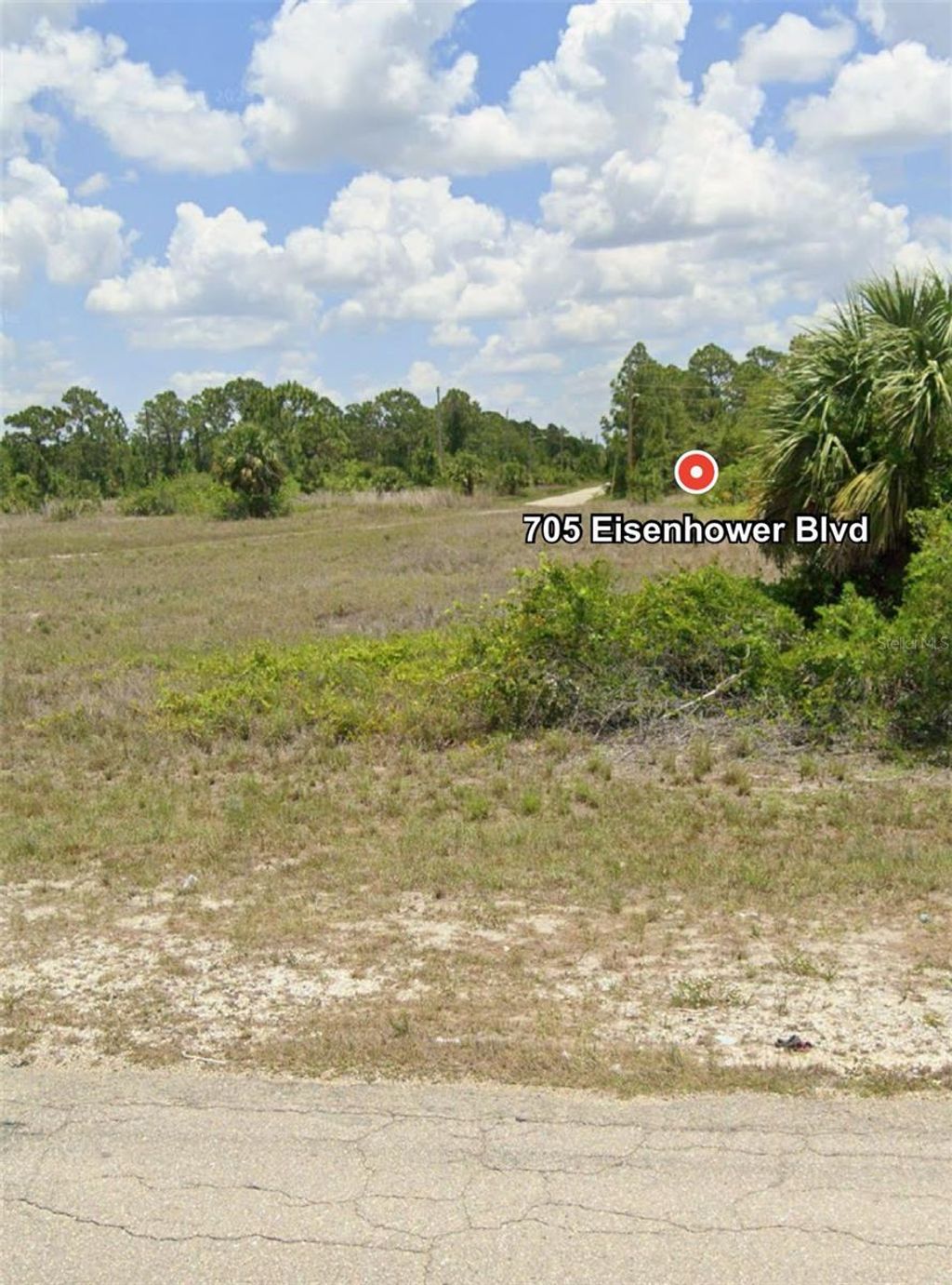 Photo of 705 Eisenhower Boulevard, Lehigh Acres, FL 33974 (MLS # O6302589)