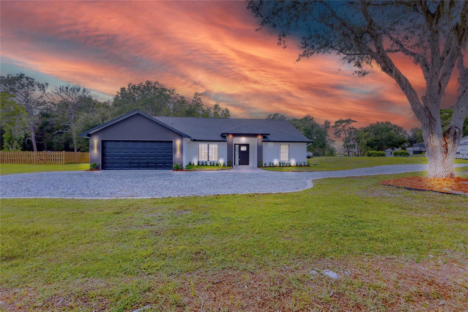 Welcome to this Modern Contemporary Farmhouse featuring 4 bedrooms, 2 bathrooms, and a double garage, all situated on a 1-acre lot in the heart of Wesley Chapel! This stunning residence offers a brand-new resurfaced pool & jacuzzi spa, a designer kitchen with waterfall countertops, and a cozy fireplace with a custom accent wall.
Inside, you’ll find luxury vinyl plank flooring (LVP), porcelain-tiled bathrooms with glass shower enclosures, and a mudroom for extra storage. The home is equipped with a whole-house water softener & filtration system and elegant landscape lighting that creates a warm evening ambiance.
Perfect for entertaining and everyday living, this property combines modern finishes with the charm of a farmhouse retreat—all on an expansive 1-acre lot with plenty of space for family, friends, boat, rv, atv, trailer and future projects.