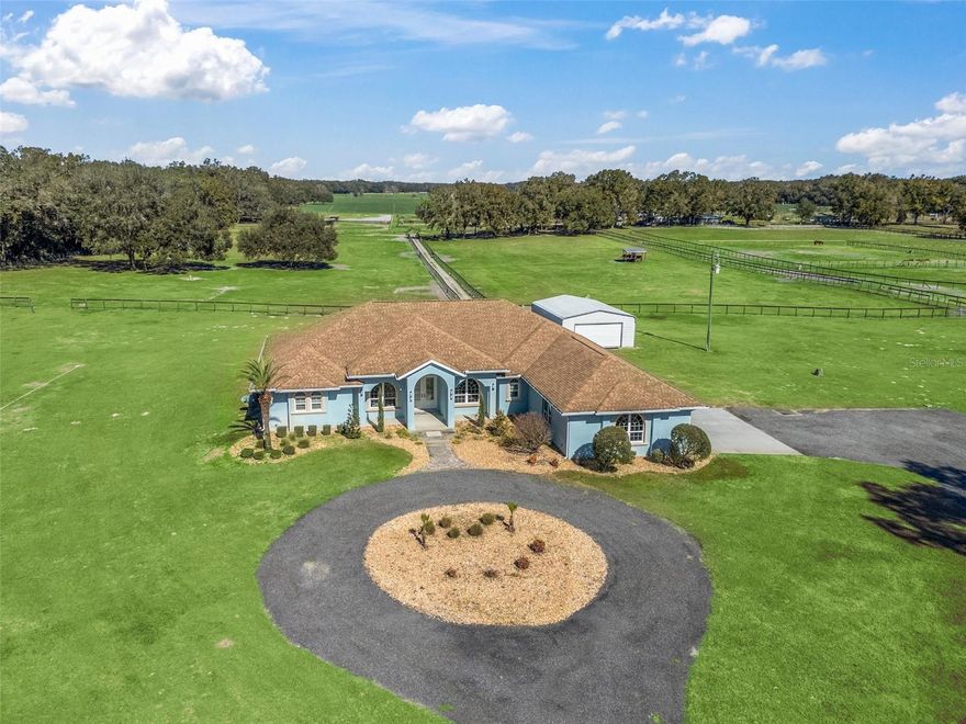 Gorgeous 30+ acre horse farm with custom build main house, guest house, barn, 2 apartments, & 14 paddocks! This 30 acre property is well located less than 10 mins to the HITS show grounds & 20 mins to the World Equestrian Center & has two separate gated entrances. The elegantly appointed 3 bedroom/ 3 full bath plus office main house has a 3 car attached garage & many high end upgrades throughout & is accessed through a gated entry. The gourmet kitchen boasts stone counter tops, double ovens, wine frig, 6-burner gas cook top, large island & huge walk-in pantry. The primary bedroom is over- sized with sitting area & direct access to the covered patio. The en-suite 5- piece primary bathroom has a generous walk-in shower & the adjoining walk-in closet is oversized with built-in shelving & a large island w/ cabinets. The adjacent large detached shop/garage has water & electric & the property boasts a propane generator, 500 gallon propane tank, tankless propane water heaters & an exterior camera system. The guest house & barn have a separate gated entry & the entire farm is fully fenced.  The 2-bedroom guest house is also concrete block construction, has 2 full bathrooms, over-sized primary bedroom walk in closet, has been updated with tile flooring throughout, & kitchen was updated with newer soft close cabinets & stone counter tops. The well-designed block barn was built in 2012 with many high-end amenities including 6, 12’ x 12’ stalls with the comfort stall systems & auto waters, 2 wash stalls with hot water, roll up hurricane doors, grooming stall, & a tack room & feed room. There is also a separate hay room. There are two barn apartments- a 1 bedroom/ 1 full bathroom & a studio with private bathroom. The paddocks have water & shelter in each & there are also 2, 50-amp rv hook ups & a large pole barn with electric & water. The property has 4 wells that are connected w/ water softener systems. The property consists of 3 parcels & can also be purchased as two separate parcels with a house on each- see listings OM713622 & OM713620.