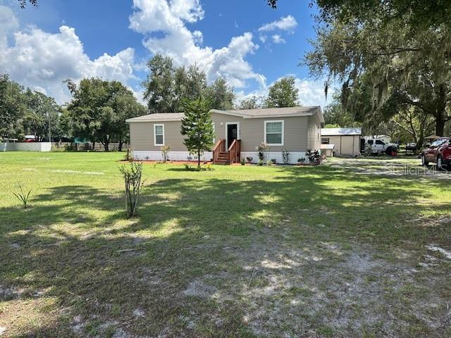 This is an Estate sale. The home is barely 4 years old.Three bedroom two bath split plan. The kitchen is bright and open to the great room. The main bedroom is spacious with a private bath and walk in closet. There is a laundry room with washer dryer hook-ups. Land is over an acre of property to create your own environment. Fruit tree and grape vines plus a shady area to sit in the shade. There are 2 sheds -one is 8 x 10 and the other is 10x 14 both with electricity. Well and septic. Located on a dead end street. Conveniently located to all shopping major roads are close by to go to Lakeland, Tampa or the beaches. The property should easily qualify for FHA financing. Apt only please call Barb for an appt.