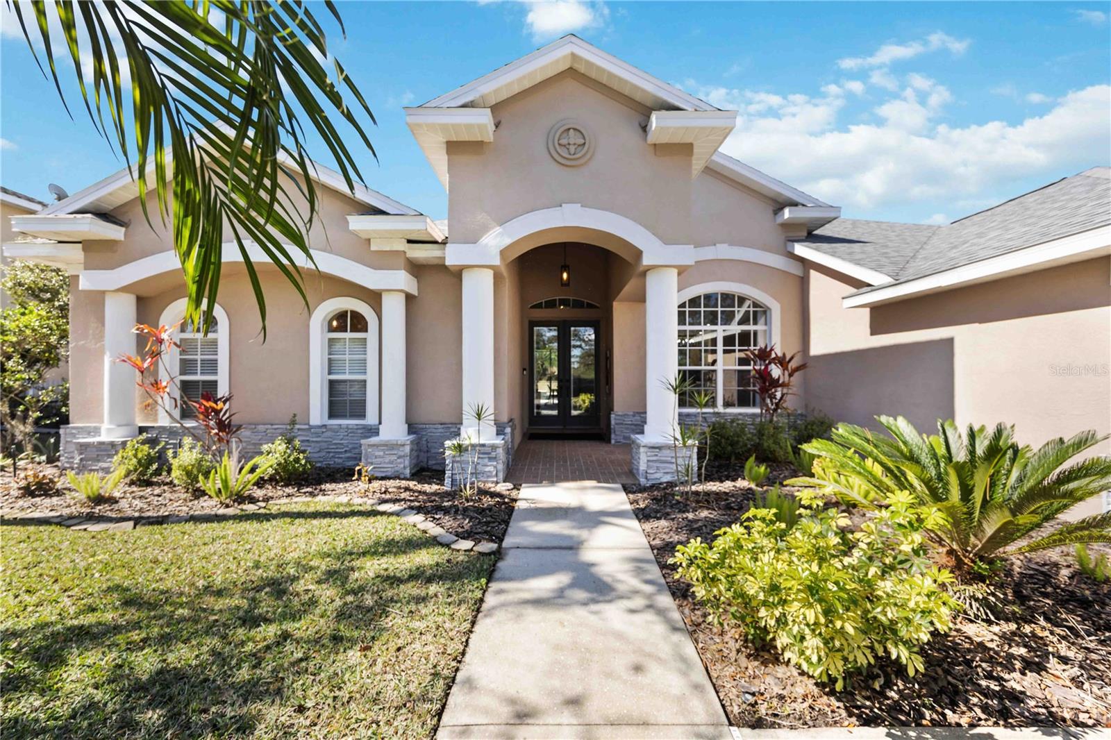 Welcome to the sought after, gated community of Greyhawk Landing, where serenity and nature seamlessly blend with modern living! This exceptional 3-bedroom, 2.5-bath Sam Rogers home is thoughtfully designed with an office/den/bonus room, offering a tranquil retreat with stunning pond views at the front and complete privacy at the back. Here, you'll frequently be greeted by the area’s abundant wildlife—deer, exotic birds, playful ducks, and turtles—adding to the charm of this peaceful setting.
The home boasts a newer roof, and is located outside of evacuation and flood zones, and offers an incredibly low HOA fee of only $75 per year. The heated saltwater pool & spa is a true gem—ideal for relaxation or entertaining, creating a true backyard paradise. Whether hosting guests or enjoying peaceful solitude, this outdoor oasis has it all.
Upon arrival, you're welcomed by meticulously landscaped grounds and an expansive 3-car garage, including a temperature-controlled 3rd bay—perfect for any hobbyist or car enthusiast. Step through the elegant double glass front doors and be greeted by soaring 16-foot ceilings. The spacious home unfolds before you, featuring oversized French doors that lead to the custom office/den/bonus space, complete with triple sliding doors to the expansive lanai and pool.
The open-concept layout flows seamlessly from the dining room, with pond views, into the chef-inspired kitchen—perfect for family gatherings or entertaining. Highlights include granite countertops, soft-close cabinetry, a pass-through window from the kitchen sink to the lanai with beautiful herringbone butcher block, a central island with seating, and generous storage. A well-appointed wet bar connects the kitchen to the oversized family room, which features built-in in-ceiling surround sound for an elevated entertainment experience.
Designed for privacy and comfort, the split-bedroom layout ensures a peaceful retreat for everyone. The primary suite is an elegant sanctuary with tray ceilings and a private slider leading to the lanai. The luxurious ensuite bath is a spa-inspired haven, featuring two walk-in closets, three vanity spaces, a freestanding tub, and a walk-in shower.
The two additional bedrooms, located on the opposite side of the home, share a beautifully appointed bath and are tucked behind a sliding pocket door for extra privacy from the main living spaces.
This home’s design emphasizes the coveted indoor-outdoor lifestyle, with easy access to the lanai and pool from the primary suite, office, kitchen, and family room. The spacious patio area is ideal for dining, relaxing, and entertaining, with an outdoor shower, a poolside restroom, and built-in gas hookups for your grill or firepit. Hosting gatherings is effortless, while enjoying Florida’s year-round sunshine is simply a bonus.
Living in this desirable community means enjoying resort-style amenities like a 24-hour guard-gated entrance, miles of scenic walking and biking trails through nature preserves, social clubs, and more. Residents have access to two stunning community pools (one with a water slide), playgrounds, lighted tennis and pickleball courts, a gym, fitness center, sports fields, a fishing pier, and bass-stocked ponds. Plus, you’re just a short 15-minute drive from the UTC shopping district, Lakewood Ranch Main Street, Waterside Place, and so much more!