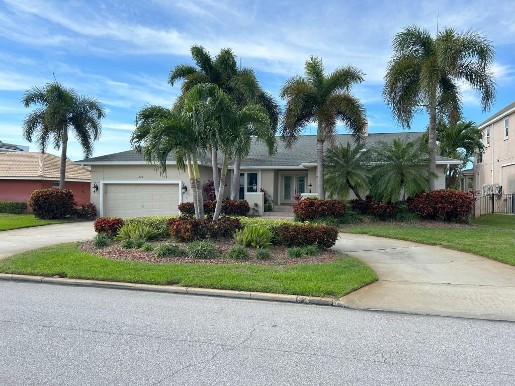Luxury living on the Grand Canal in Tierra Verde. Large new Speeler Trex Dock with new high speed 10,000 pound Neptune boatlift. View of 'The Don' from the new pool enclosure with screened in solar heated pool and relax on the large deck for dining outside and entertaining. Great neighborhood with upward trends! You will love the floor plan and livability. Completely renovated in 2008. Entry leads to great room with vaulted ceiling and soaring wood-burning fireplace. Separate dining room. Dinette is large and also has views of the 'Don'. Master and great room also have new hurricane rated tinted doors that slide away to the raised porch deck. Large walk-in pass-through closet. Split floor plan with 3 nice sized bedrooms. Large laundry room with half bath. Large 2 car garage with storage racks above. Newer water softener. Lots of lawn for relaxing. Quick trip to the Gulf with no bridges. Central AC is one year old with programable iPhone app. Murphy queen bed with office in one bedroom. New ADP Security System installed. Wrapped pilings. Offered fully furnished.