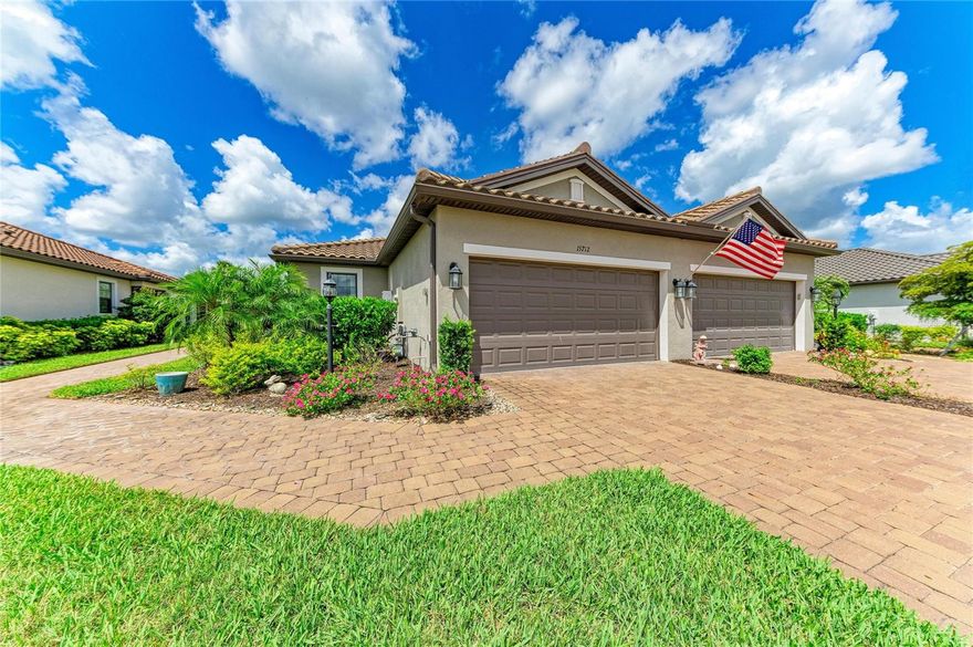 Imagine waking up each day to the elegance of resort-style living in the exclusive Esplanade at Azario, one of Lakewood Ranch's most coveted luxury communities. Blending sophistication, comfort, and an unparalleled lifestyle, this impeccably appointed villa offers a rare opportunity to enjoy refined, maintenance-free living surrounded by breathtaking surroundings.  From its designer-curated finishes and timeless neutral palette to its extensive collection of premium upgrades, every detail has been thoughtfully crafted to elevate everyday living.  Featuring 2 bedrooms, 2 bathrooms, and a versatile den, this thoughtfully designed home offers elegant tile flooring throughout the main living areas and an open-concept floor plan ideal for everyday living and entertaining.  The stunning chef's kitchen is enhanced with upgraded appliances, a custom designer backsplash, premium cabinetry with convenient pull-out drawers, an oversized refrigerator, designer lighting and exquisite custom moldings.  The spacious primary suite features custom-finished closets and a luxurious bath with upgraded tile and upgraded finishes.  The guest bath is equally impressive with custom tile work and quality appointments.  A fully finished laundry room includes additional cabinetry for storage and organization.  Step outside to the extended screened lanai and enjoy peaceful views of the private backyard, creating the perfect setting for morning coffee, outdoor dining, or simply relaxing in your own tranquil retreat.  Residents of Esplanade at Azario enjoy an unparalleled lifestyle with world-class amenities, including resort-style pools, a full service spa and salon, fitness center, tennis and pickleball courts, walking trails, playground, Bahama Bar, Barrel House Bistro, Culinary Center, Oak and Stone Pizzeria, coffee shop, and an 18-hole championship golf course.  Experience the ultimate Florida lifestyle in the heart of Lakewood Ranch, where luxury, recreation, and convenience come together beautifully.
