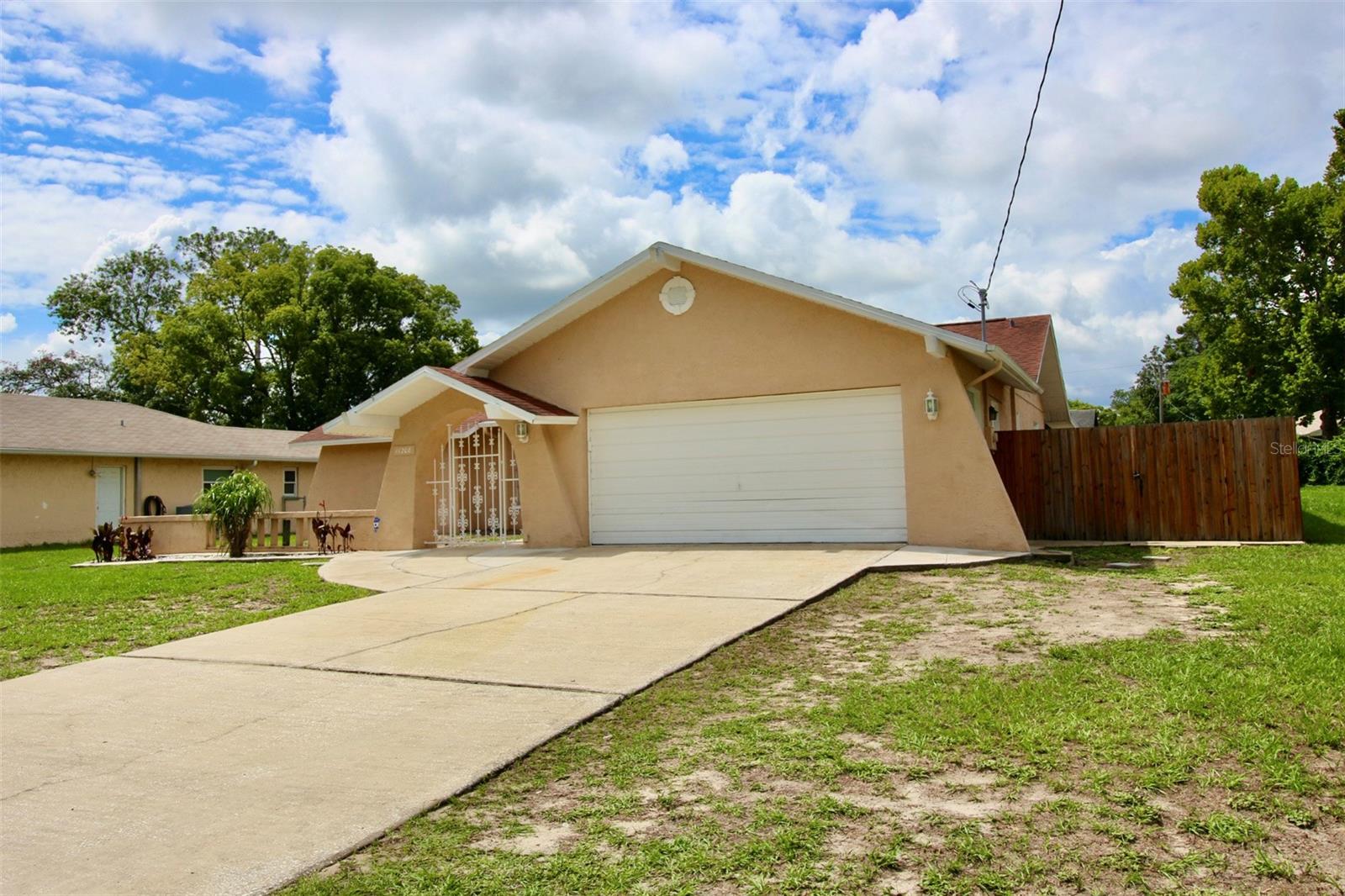 **SPARKLING POOL HOME IN THE HEART OF SPRING HILL** Desirable 3 bedroom, 2 full bath, 2 car oversized attached garage! This home was built for entertaining all of your family and friends with over 1500 heated square foot of living area. Spacious Chef's kitchen with butcher block style countertops, decorative tile backsplash, deep double sink, pantry, eat in kitchen area and lots of cabinet space. Kitchen has breakfast bar overlooking the huge living room and dining area. This versatile floorplan has an extra room with exterior backyard access that has endless possibilities. This room could be a formal dining room, family room, office or 4th bedroom....Split bedroom plan with a huge primary bedroom, large walk in closet and private bath. Low step in double shower with tile surround and built in bench. Second bedroom has a double closet and private guest bath access. Guest bath has tile surround tub/shower combo and built in seating area. Interior laundry room with full size washer and dryer space and utility sink leads to the oversized 2 car garage with side door access and lots of extra storage space. Roof 2017, Lennox full AC system 2022, Puronics whole home water conditioner 2018, water heater 2019. High and dry X flood zone, no hoa or deed restrictions. Solid block and stucco exterior. Huge 24X10 covered and screened outdoor living area overlooking your FLORIDA LIFESTYLE PARADISE! Sparkling above ground pool with professional poured foundation, clear bay pump and filter. Separate soothing heated SALUSPA with thermostat control and cover. Super private backyard with durable board on board fencing and double gate for your rv, boat and all your toys! Almost a quarter acre lot with firepit and lots of secure space for children and fur babies! Easy access to the Suncoast Parkway, I-75 and all major highways going up and down Florida's beautiful Gulf Coast! Call and schedule your private showing and make this your FLORIDA STAYCATION HOME TODAY!
