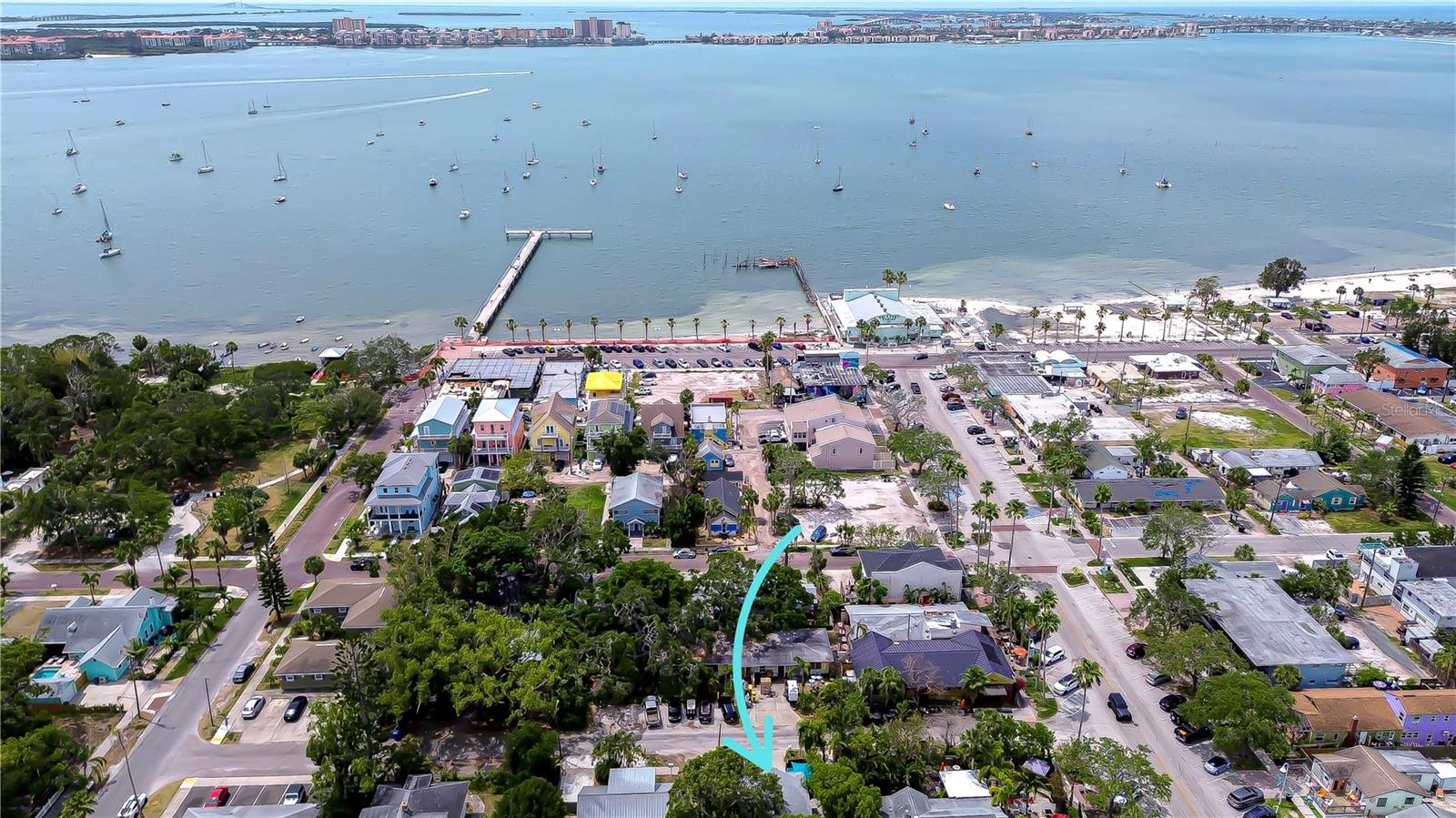Prime Investment Opportunity in the Heart of Gulfport’s Historic Waterfront District! Don’t miss this incredible chance to own a move-in ready duplex located just steps from all the charm and excitement Gulfport has to offer! Whether you're looking to live in one unit and rent the other, or maximize your income by leasing both, this property delivers unbeatable flexibility and long-term value. This well-maintained income-producing duplex features a spacious 2 bedroom / 2 bath apartment downstairs and a charming 1 bedroom / 1 bath apartment upstairs—each with its own electric meter and a shared water meter. The downstairs unit is fully furnished and has been successfully rented as a monthly rental, making it a turnkey option for immediate income. Inside, you’ll find a welcoming living room with cozy seating and a large-screen TV, ideal for relaxing or entertaining. The beautifully updated kitchen is equipped with granite countertops, crisp white cabinetry, and stainless steel appliances. Both bedrooms are generously sized with comfortable queen beds, creating a delightful retreat for guests or tenants. Upstairs, the 1-bedroom apartment is already rented with a stable annual tenant in place! This bright and spacious unit features an oversized living room, an updated kitchen with sleek gray cabinets, white tile backsplash, stainless steel appliances, and space for a small dining setup. The large bedroom is flooded with natural light and includes a second door with exterior access—adding extra convenience and privacy. A shared laundry room is located on the ground floor, and the outdoor space is perfect for enjoying Florida’s sunshine—ideal for morning coffee, evening wine, or weekend gatherings. All of this is located just behind the iconic Pia’s Trattoria, placing you steps away from Gulfport’s best dining, shopping, entertainment, parks, and waterfront attractions. Opportunities like this don’t last long—schedule your private showing today and take the next step toward owning a piece of Gulfport’s historic charm!