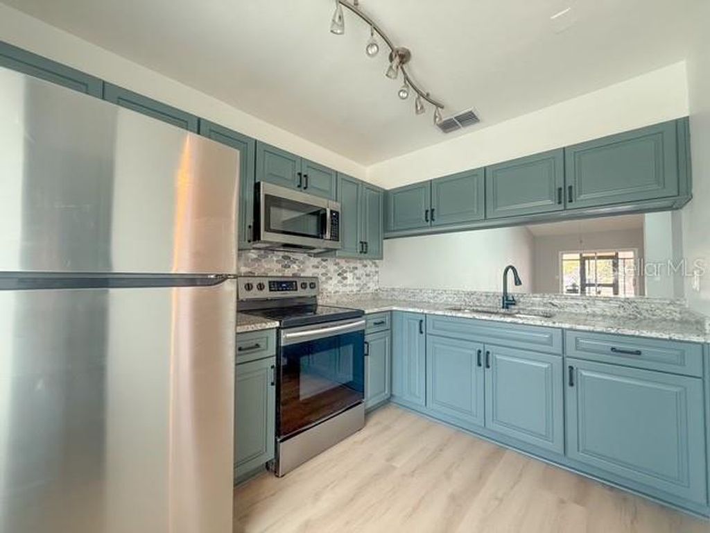 Photo of 5415 Parkside Villas Drive, St Petersburg, FL 33709 (MLS # W7883256)