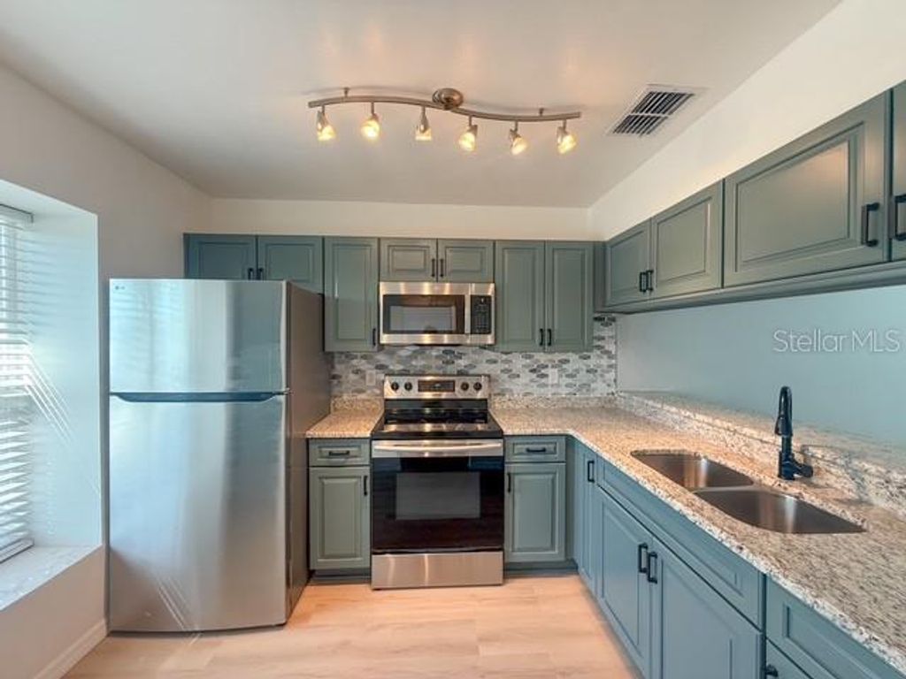 Photo of 5415 Parkside Villas Drive, St Petersburg, FL 33709 (MLS # W7883256)