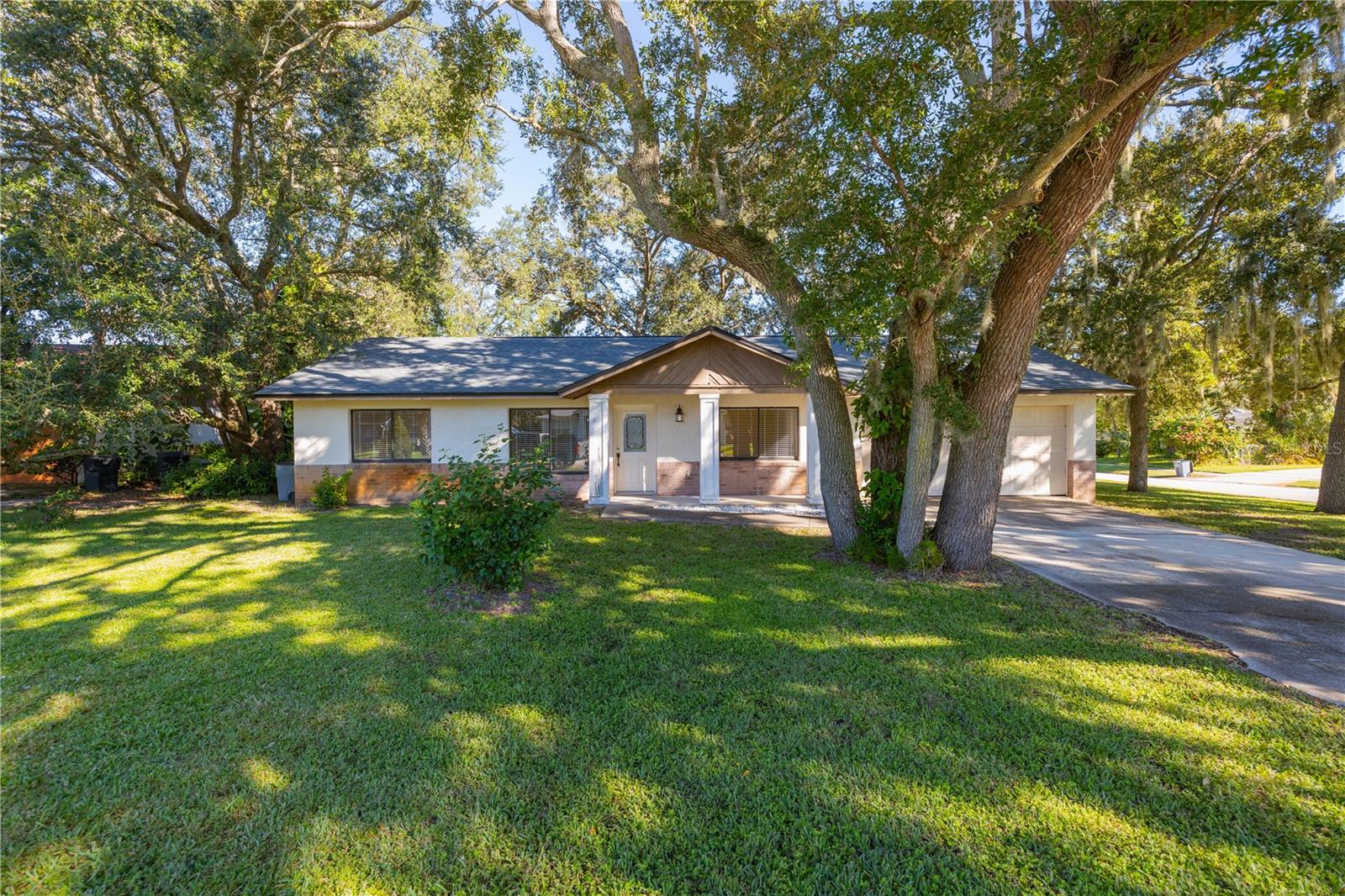 Welcome to this charming 4-bedroom, 3-bath home perfectly situated on a spacious corner lot in one of Port Orange's well established, desirable neighborhoods. This property offers a blend of comfort, convenience, and classic Florida living. Step inside to find a bright, open living area with plenty of room for family and guests. The galley-style kitchen provides efficient design and functionality, complete with ample cabinetry and counter space for everyday cooking and entertaining. The primary suite offers privacy and its own ensuite bath, while the additional bedrooms offer flexibility for guests, a home office, or hobbies. Recent updates include a 3-year-old roof and 5-year-old HVAC system, giving you peace of mind for years to come. Enjoy the large corner lot, ideal for outdoor gatherings, play, or future enhancements like a garden or pool. Conveniently located close to top-rated schools, shopping, dining, public parks, and just minutes to the beach, this home combines the best of established neighborhood living with modern comfort.