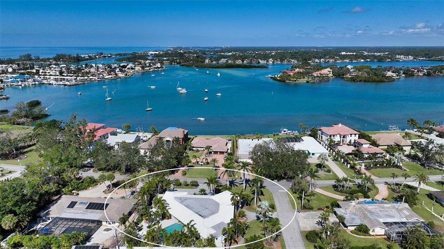 Welcome to your dream home on Venice Island! This spacious 4399 square foot home boasts Thermopane windows throughout, providing both style and efficiency. The porcelain tile flooring, crown molding, and plantation shutters add a touch of elegance to the home. As you enter the home, you are greeted with a great room that boasts over 1300 square feet with travertine pillars, double octagon tray ceiling that soars 12ft with recessed lighting and a wall of glass sliders that open to the expansive lanai area. The chef's kitchen is a dream come true with top-of-the-line appliances including Subzero refrigerator, built-in wine cooler, and refrigerator drawers. A 5-burner gas cooktop, solid wood soft-close cabinetry, large center island, wall of cabinets and built-in hutch with an eat in kitchen area make this room a favorite! The dining room is voluminous and easily accessed off the kitchen and great room areas with fabulous travertine pillar accents. Split bedroom plan with the master bedroom offering a huge walk-in closet with tons of built-in features with easy access to the lanai area. The master ensuite bathroom offers a step-in shower, tiled walls with listello accents, jacuzzi tub with a showerhead feature and easy access to the lanai area and can double as one of the cabana baths. Bedroom two is large, offers textured walls and a built-in desk/entertainment space and is steps from bathroom two that features a walk-in shower, floor to ceiling tile with decorative accents in-laid, granite countertop, and access to an outdoor patio that will lead you to the lanai area and doubles as another cabana bath. Bedroom three is spacious also offering another ensuite bathroom and convenient access to the lanai. Solid teakwood cabinetry with deco-braided crown molding line the walls of the office with two built-in desks and recessed can lighting. The lanai area is sprawling, offers an expansive lap pool, free-standing hot tub, large cabana area, fire pit area, and a fabulous outdoor kitchen with top-of-the-line features. It’s your own outdoor oasis that provides tons of privacy. Home offers an oversized garage, an outdoor undercover workshop area, circular driveway, portico, and tons of parking. Enjoy the Venice Island lifestyle at its finest, just minutes away from beaches, downtown Venice, and all its restaurants, theaters, shopping and more!
