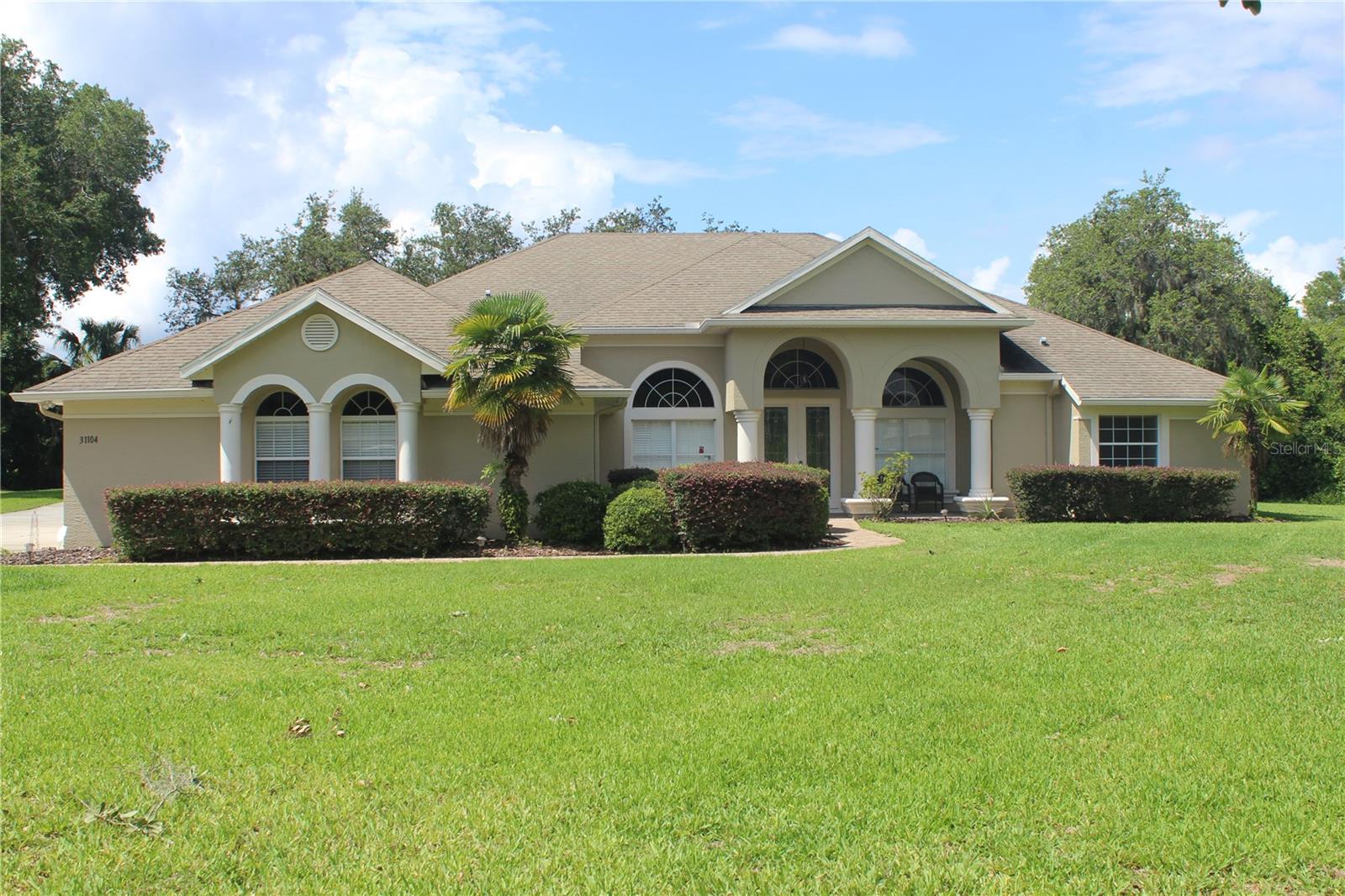CAR ENTHUSIASTS DREAM! Are you looking for a country like home setting with space between you and your neighbor? How about a specious 3-bedroom, 2 bathroom turnkey home located in Tavares, sitting on an acre of land? If that's not enough, this corner lot home comes with a 3-car side entry garage, plus another detached garage big enough for two cars, plus big enough for a car rack. Use it as a workshop or for more storage space. This detached garage has heat, air conditioning and is plumbed. This is a beautiful custom-built home with some nice built-in features. A large covered and screened in back porch for entertaining or just relaxing. Don't miss this opportunity to finally find the home you've been looking for. New roof to be replaced prior to closing.