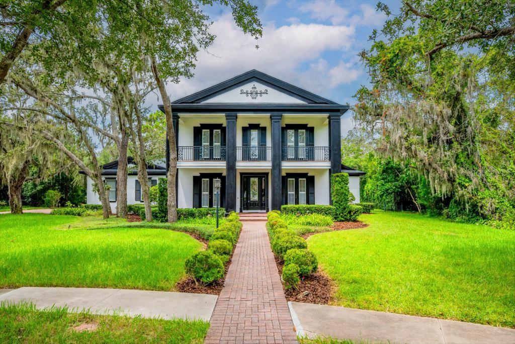 A Wonderful Story Book Setting. Come see this Majestic Home located in the Gated community of Dunlin Wood of Fishhawk Ranch! One of the community’s premier villages. Spacious elegance meets modern comfort in this extraordinary luxury home, nestled on a serene, tree-lined cul-de-sac. Built by the esteemed Hyde Park Builders, the stately Southern-inspired Beaumont model offers over 5,000 square feet of meticulously crafted living space, featuring 4 spacious bedrooms, 4.5 luxurious baths, and unmatched architectural detail throughout. From the grand brick-paver driveway to the oversized 3-car garage with epoxy flooring, every detail exudes quality and sophistication. Inside you'll discover new floors, double crown molding, plantation shutters, and custom trim work set the tone for refined living. The chef’s kitchen is a showstopper—complete with custom cabinetry, stainless steel appliances, walk-in and butler’s pantries (with wine chiller), and a large center island with 5-burner gas cooktop and designer hood. The open living areas overlook a stunning 36x14 heated pool with travertine deck, outdoor fireplace, summer kitchen, spa, and lush tropical landscaping—an entertainer’s dream. Retreat to the expansive first-floor owner’s suite with spa-inspired bath and an enormous walk-in closet with custom built-ins. Upstairs, a spacious media/bonus room with projector and screen is flanked by additional bedrooms and a wrought-iron balcony. Situated in the award-winning FishHawk Ranch community, this home provides access to top-rated schools and resort-style amenities including clubhouses, multiple pools, pickleball and tennis courts, a skate park, and scenic nature trails. This is more than a home—it’s a lifestyle. Don't miss your opportunity to own one of Dunlin Wood’s finest residences!