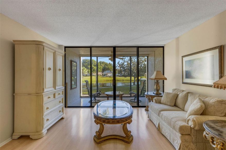Welcome to your slice of Florida living - where comfort, style, and location come together beautifully.  Step inside this GROUND FLOOR unit to find a beautifully updated, FRESHLY PAINTED condo that's light and bright, with an inviting layout. Easy access from the parking to your front door with convenient mail pickup/drop off right near your front door. The UPDATED kitchen features sleek QUARTZ countertops, refaced cabinetry, and a distinctive BEADBOARD Ceiling that adds warmth, character, and that "beachy" feel. Both FULL bathrooms have been tastefully renovated, offering modern finishes and a clean, fresh feel. The primary bedroom (With a View of Pond) has a WALK-IN CLOSET and an ensuite with double sinks, granite countertops, and a tub/shower combination. The guest room ensuite has a BRAND NEW SHOWER and VANITY. Another highlight is the enclosed Florida Room overlooking a SERENE POND that creates a tranquil backdrop year-round.   
    Ideally situated in a highly desirable area, you'll enjoy being a short drive from the Gulf beaches, along with convenient access to shopping, dining, and everyday essentials.  Whether you're looking for a full-time residence or a seasonal getaway, this home delivers the best of Florida Living in a location that's hard to beat.