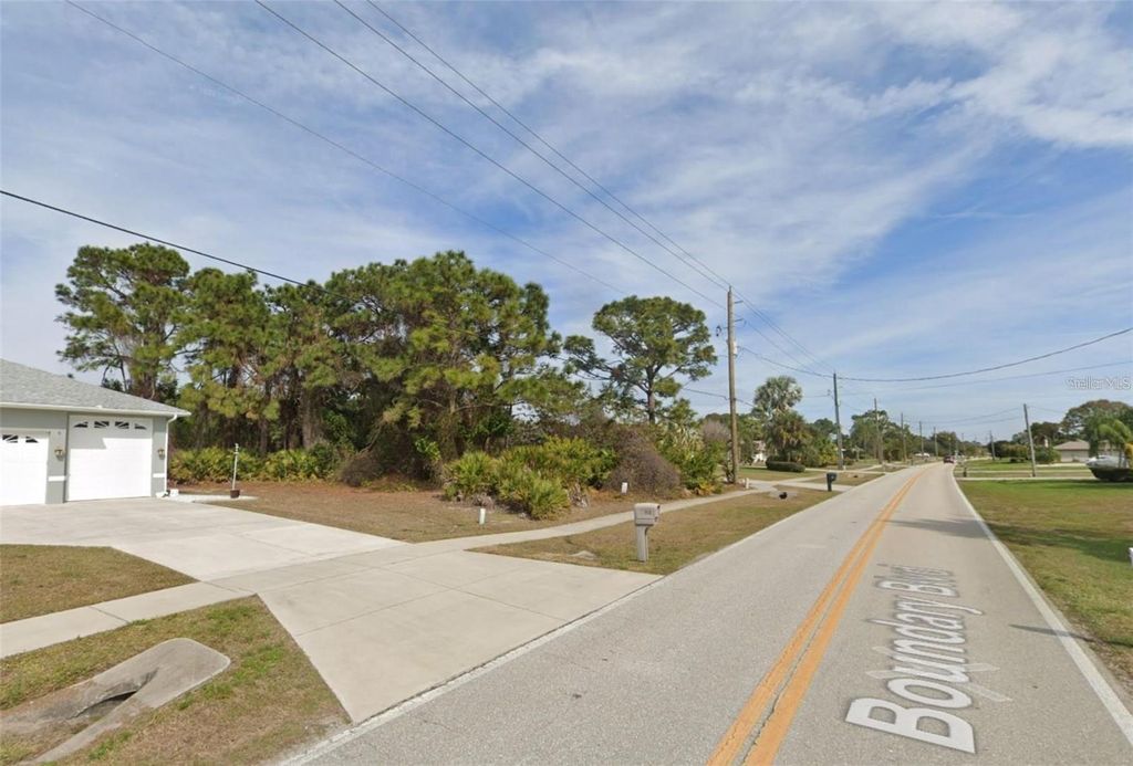 Photo of 517 Boundary Boulevard, Rotonda West, FL 33947 (MLS # A4667639)