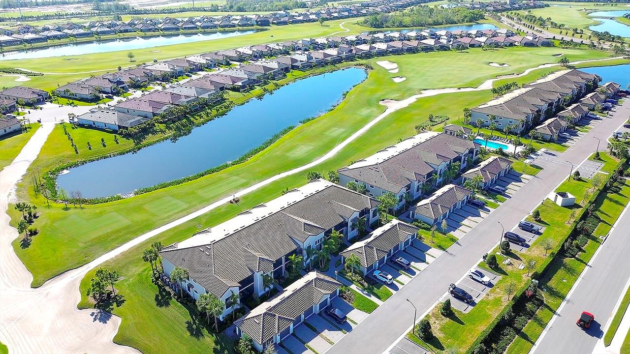 TASTEFULLY DECORATED and meticulously maintained, this TURNKEY FURNISHED and "GOLF INCLUDED" top floor Veranda is MOVE-IN ready. Overlooking the 9th hole of the Piper course you’ll enjoy tranquil golf course and water views from this popular Bromelia II floor plan with 2 bedrooms 2 bathrooms, DEN and detached GARAGE. The OPEN FLOOR PLAN features HURRICANE RATED high impact windows and doors for your protection and peace of mind, upgraded light fixtures & ceiling fans, Ring doorbell, 2 generous screened lanais (one with new sunshade), new storage cabinets in laundry, vaulted ceilings, crown moldings and porcelain tile floors that extend to the screened lanai. The well-equipped MODERN KITCHEN is open to the living area and features quartz countertops, solid wood cabinets, S/S appliances, breakfast bar and central island perfect for entertaining. The DEN provides valuable bonus space that is flexible and adaptable to a variety of uses and is currently configured as a comfortable TV/Media room. It’s worth noting the current owners are the original owners occupying it only seasonally, non-smokers and do not own pets. Located securely within the gates of LAKEWOOD NATIONAL GOLF & COUNTRY CLUB you’ll enjoy AMAZING AMENITIES that include DEEDED MEMBERSHIP in 2–18 hole Arnold Palmer championship golf courses, a grand clubhouse, a culinary center for fine dining, resort style swimming pool area with poolside café and Tiki Bar, heated satellite pools, eight lighted Har-Tru tennis courts, PICKLEBALL courts, two Har-Tru bocce courts, state-of-the-art fitness center with 24/7 access, full-service spa, fully maintained lawns and 24 hour security, all for a low monthly fee. Lakewood National also has a progressive rental policy with transferable memberships, popular with seasonal renters, if generating income is on your radar. It’s no wonder Lakewood Ranch is the #1 bestselling multi-generational master planned community in America with excellent schools, parks, bike trails, fine restaurants, abundant shopping and just a short drive to the area’s world-class beaches, theaters, galleries and so much more. TRULY A GOLFER’S DREAM!! LIVING IS EASY, CONVENIENT AND SECURE IN THIS ACTIVE LIFESTYLE COMMUNITY! This unit has it all - just bring your suitcase and enjoy! A Seller approved inventory, and a floor plan are attached to listing.