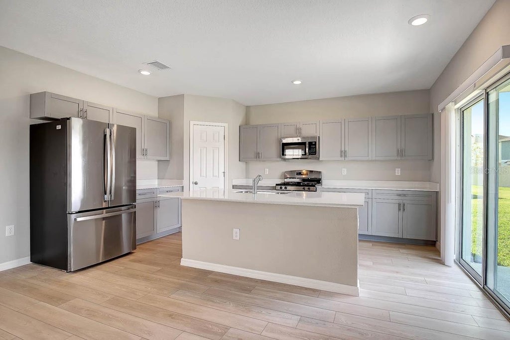 Photo of 12932 Wellspring Drive, Lithia, FL 33547 (MLS # TB8556610)
