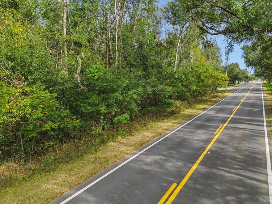 2.5 Acre building lot between Zephyrhills and Dade City. The lot is high and dry with trees. New homes adjacent to lot. Paved Road. No homeowner's association, no CDD fees. Zoned for homes or manufactured homes. The lot is 171'x637'.